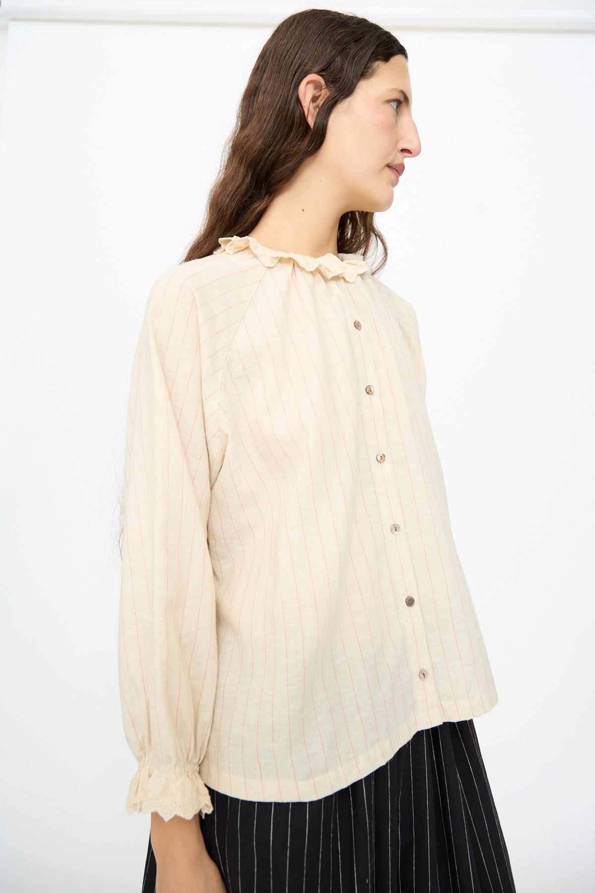 Ichi Antiquités Pinstripe Shirt in Natural: a long-sleeved, beige pinstripe linen shirt with a lace ruffle collar and cuffs, buttoned down the front.