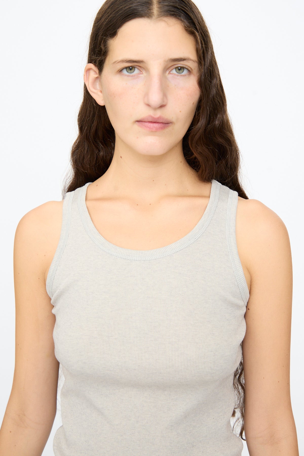 A person wearing an Ichi Antiquités Rib Tank Top in Gray, a slim-fit, ribbed cotton tank.
