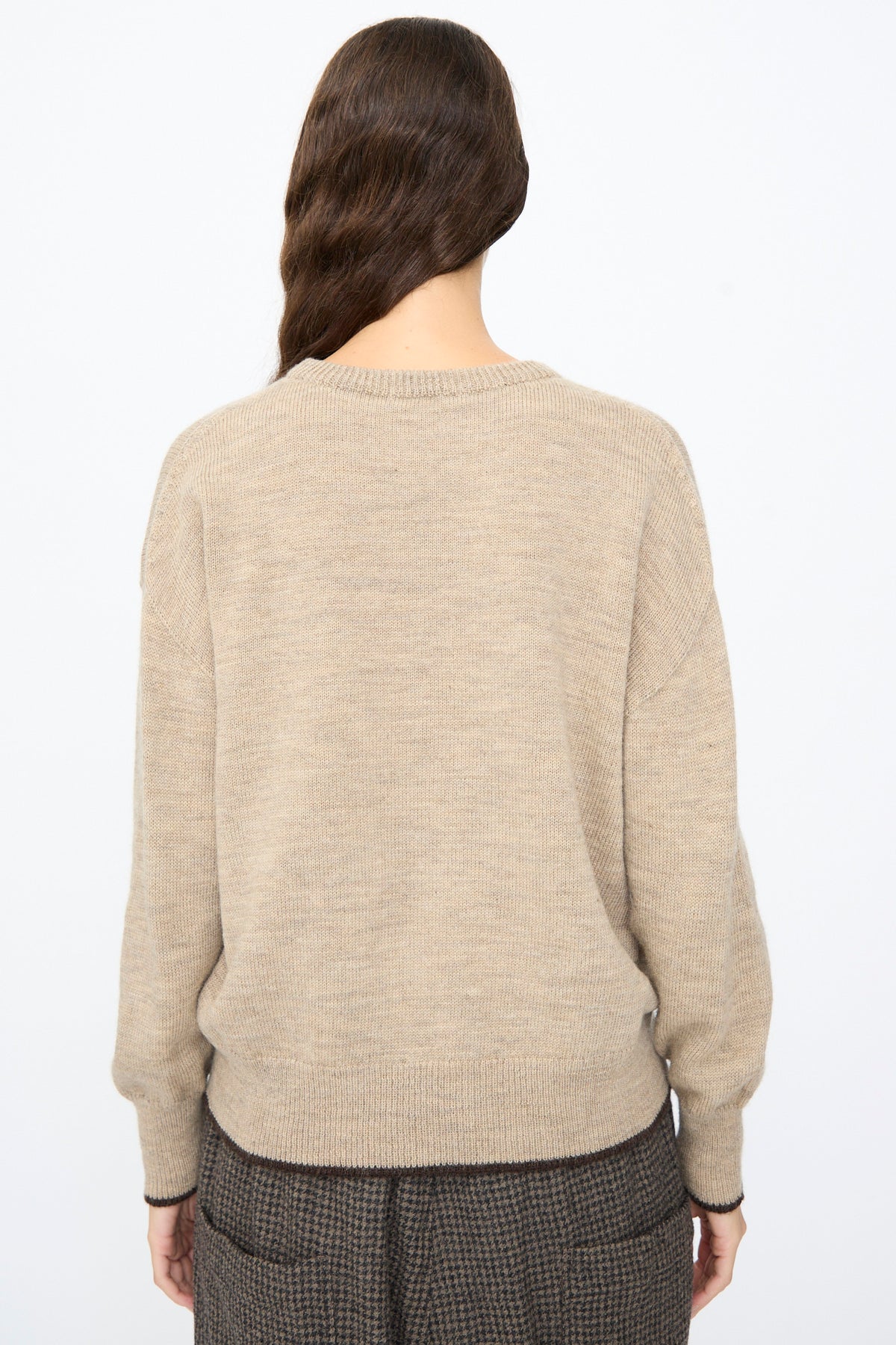 Ichi Antiquités Wool Pullover in Beige and Brown worn over dark brown patterned trousers.