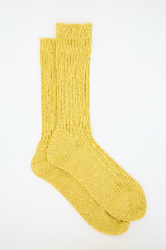 A pair of Linen Rib Sock in Yellow by Ichi Antiquités is laid flat against a white background.