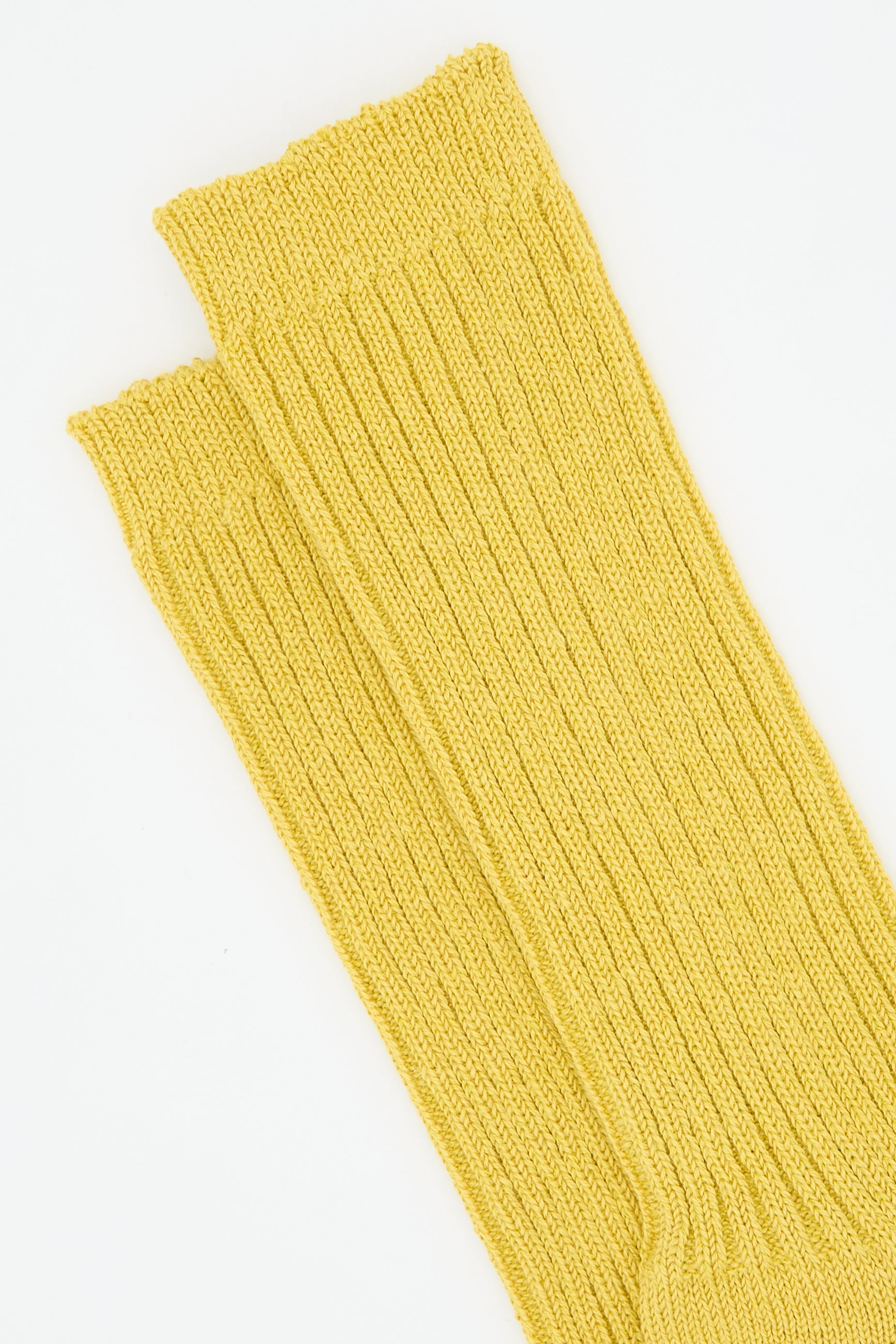 A pair of Linen Rib Sock in Yellow by Ichi Antiquités is displayed on a white background.