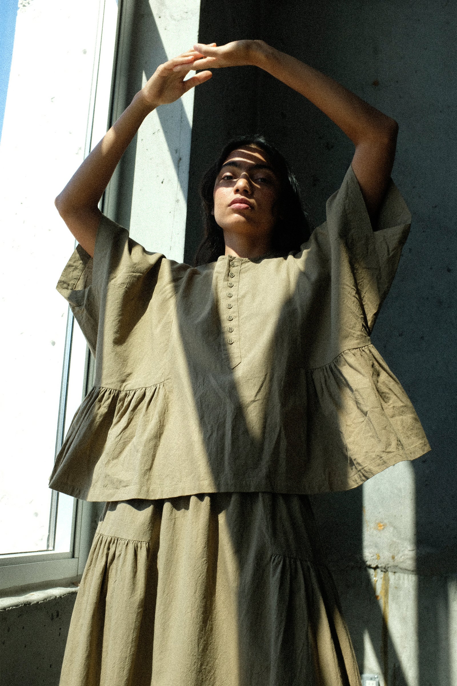 Person Ichi Antiquités Cotton Linen Shirt in Mocha against a plain background