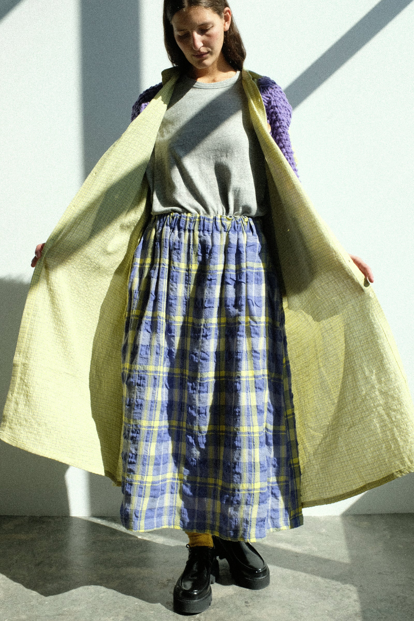 A woman wearing pieces from the FW25 Ichi Antiquités collection against a white background.