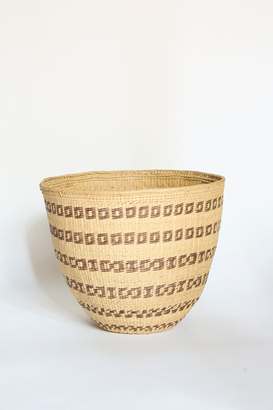 The Yanomami Wii Basket Large in Natural with Squares by Incausa is a handwoven storage basket crafted from Titica vine, featuring geometric brown square patterns arranged in horizontal rows on a light tan background, inspired by traditional Yanomami designs from the Amazon and displayed against a plain white surface.
