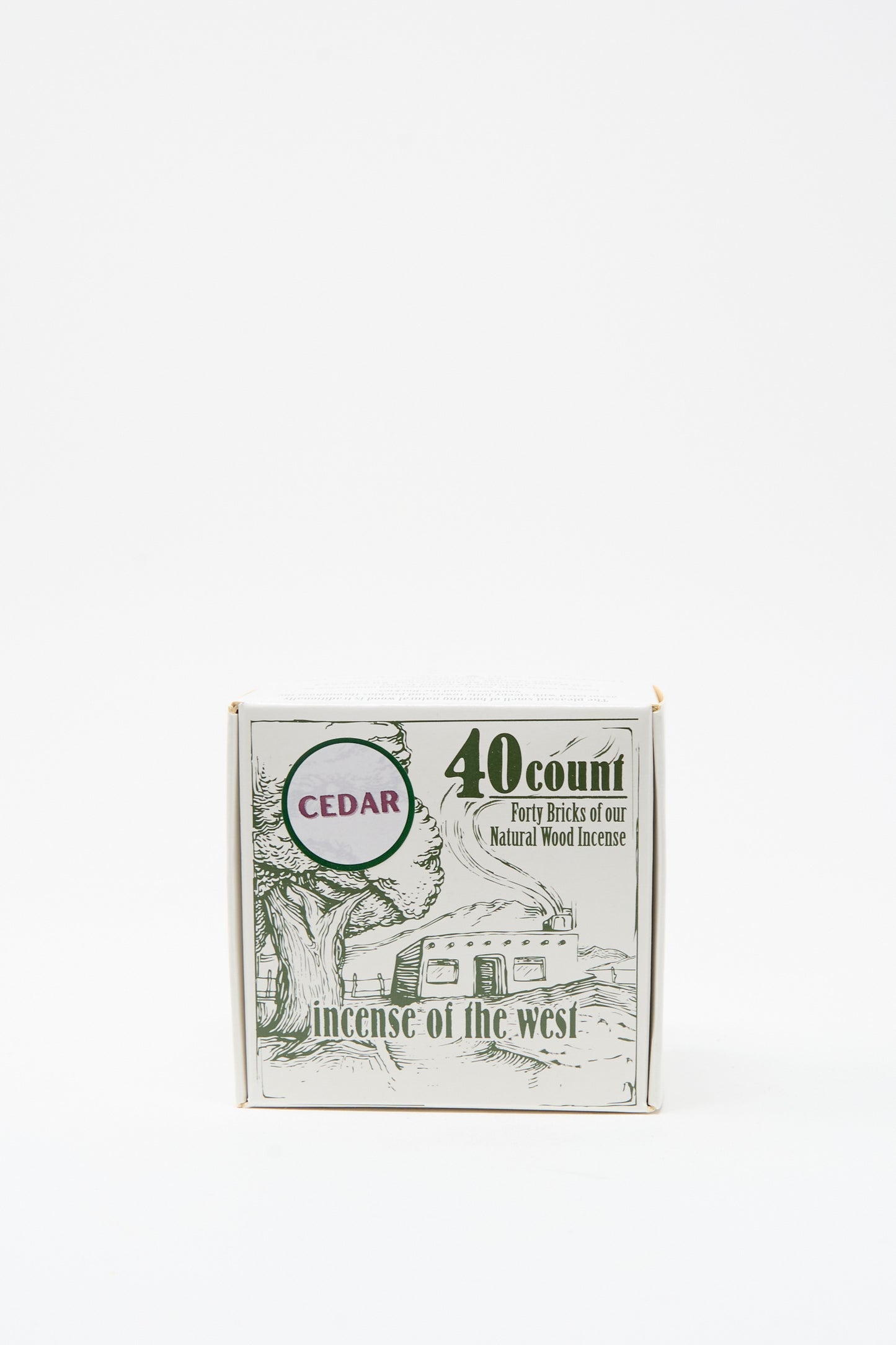 The Cedar Incense Box by Incense of the West contains 40 cedar wood incense bricks with a rich cedar scent and comes in packaging featuring a tree and cabin, inspired by New Mexican clay designs.
