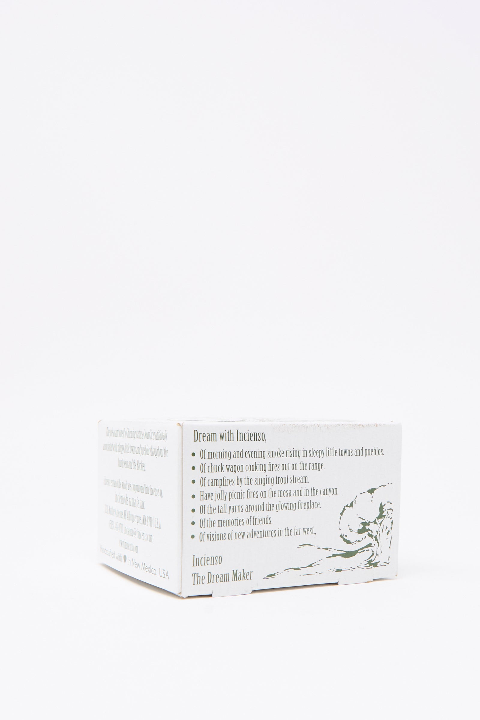 A white "Fir Balsam Incense Box" by Incense of the West features printed details and a simple mountain and tree illustration, evoking the fresh scent of balsam fir in an evergreen forest. Perfect for pairing with your favorite incense burners.