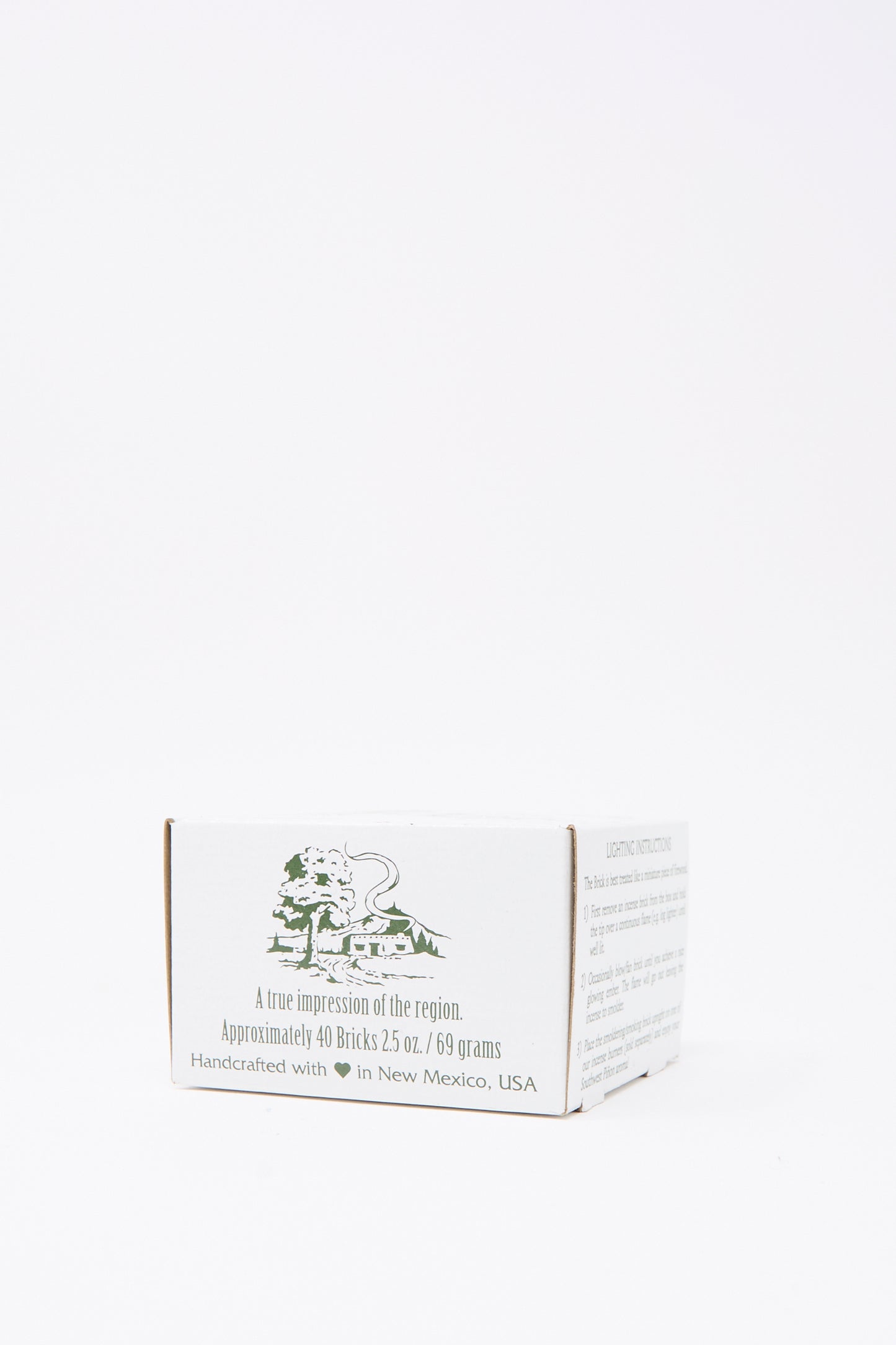 The Fir Balsam Incense Box by Incense of the West is a small white box with green text and graphics, containing approximately 40 handcrafted balsam fir bricks from New Mexico, USA.
