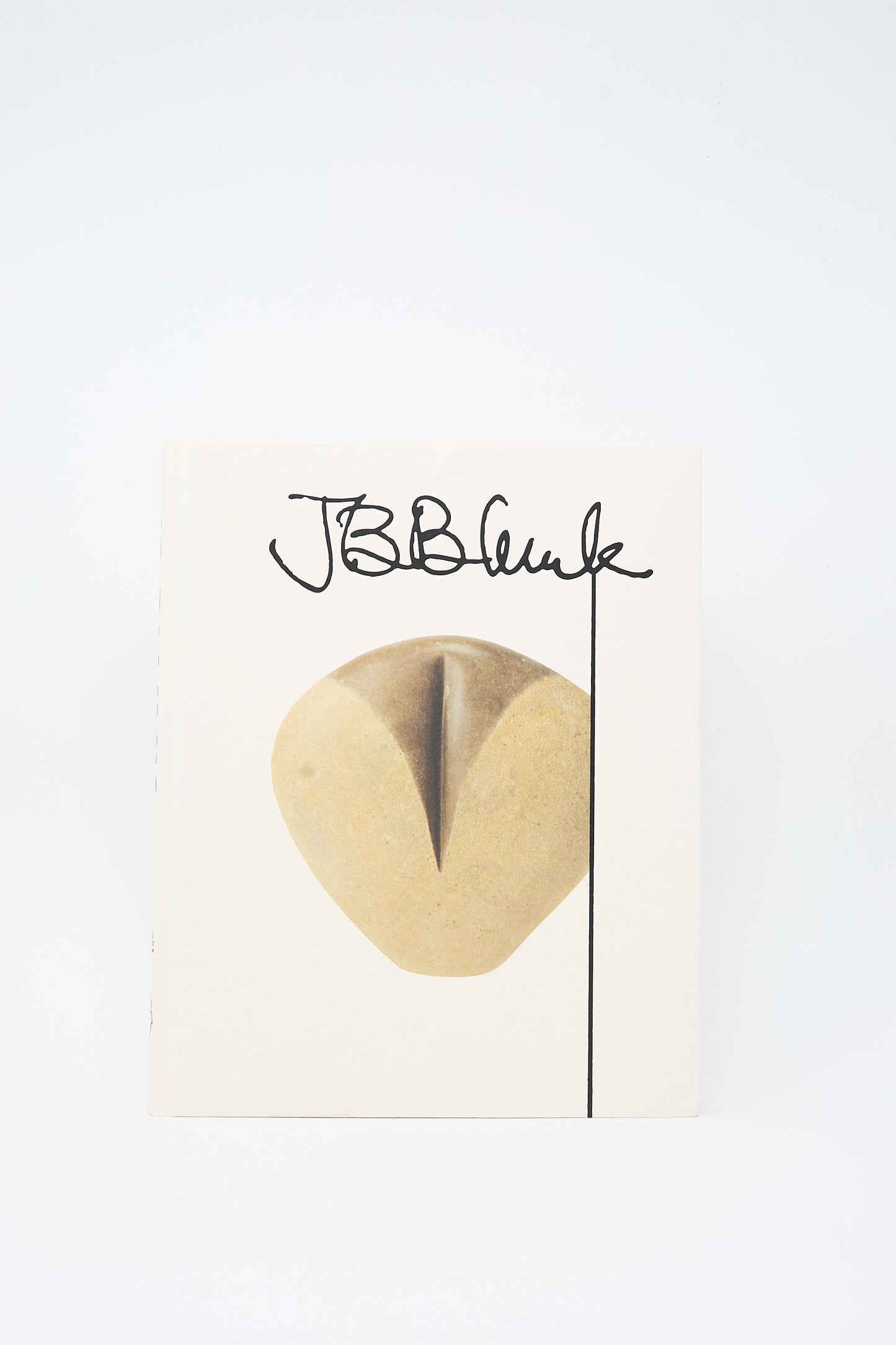 The book cover of "Fourth Edition" features a minimalist sculpture with the initials "J.B." in bold black script above it, subtly nodding to the influential practice of JB Blunk. The white background highlights the elegance of this design.