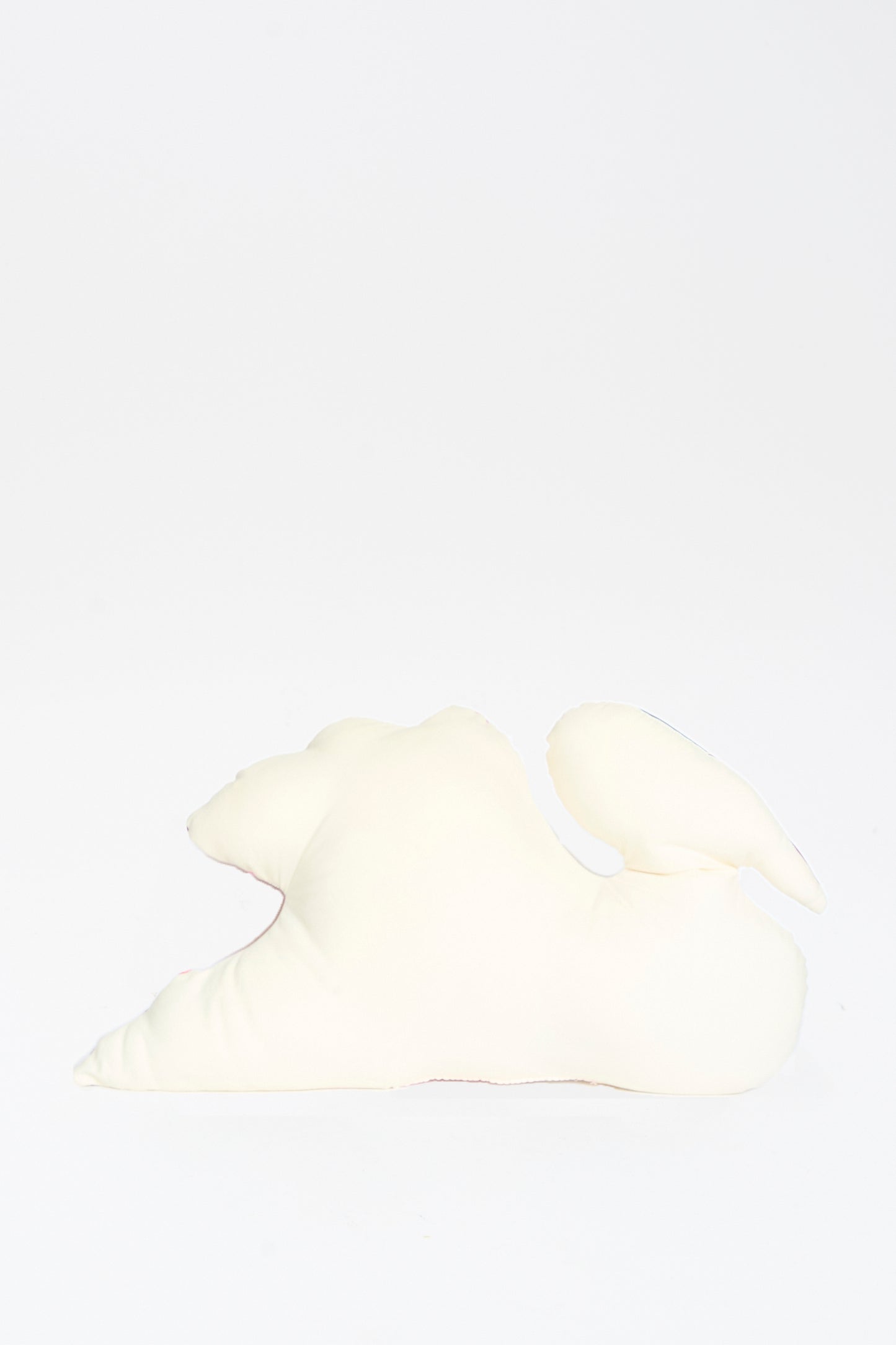 The Hand Painted Swan Pillow I by Jess Feury, featuring a soft abstract swan shape, is displayed on a plain white background.