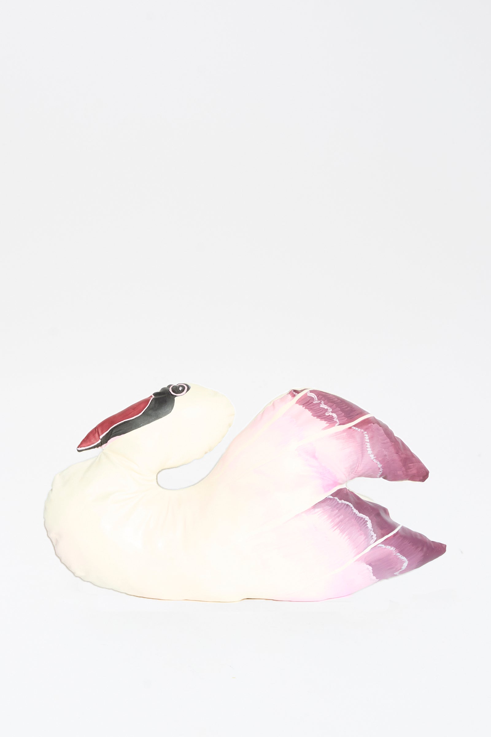 The Hand Painted Swan Pillow III by Jess Feury, featuring a white and pink swan motif with a hand-painted look, is displayed against a plain white background.