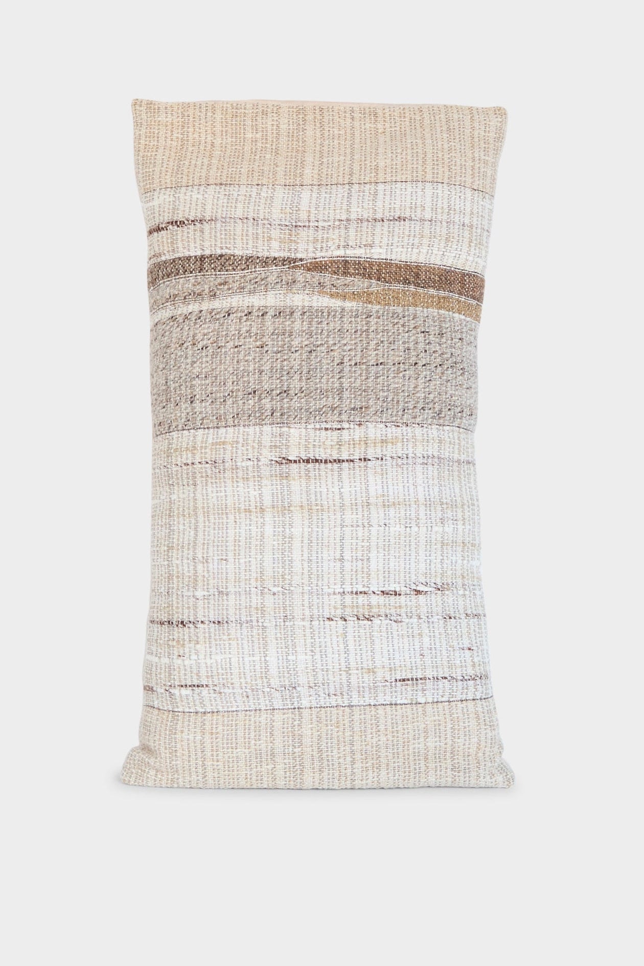 The Handmade Rock Slab Pillow in Neutral Tones by Jess Feury features a woven texture, horizontal stripes in beige, cream, and brown, and is handwoven from sustainable fibers for an eco-friendly accent.