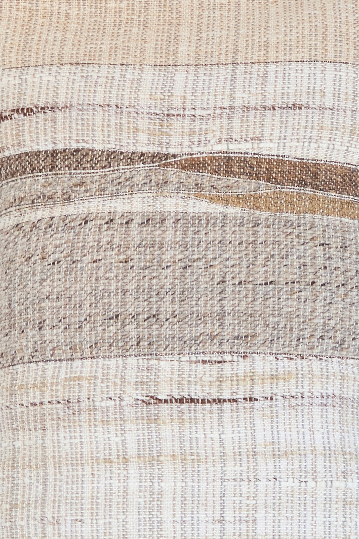 The Jess Feury Handmade Rock Slab Pillow in neutral tones features woven horizontal stripes of beige, brown, and cream with textured threads, crafted from sustainable fibers for an eco-friendly touch.