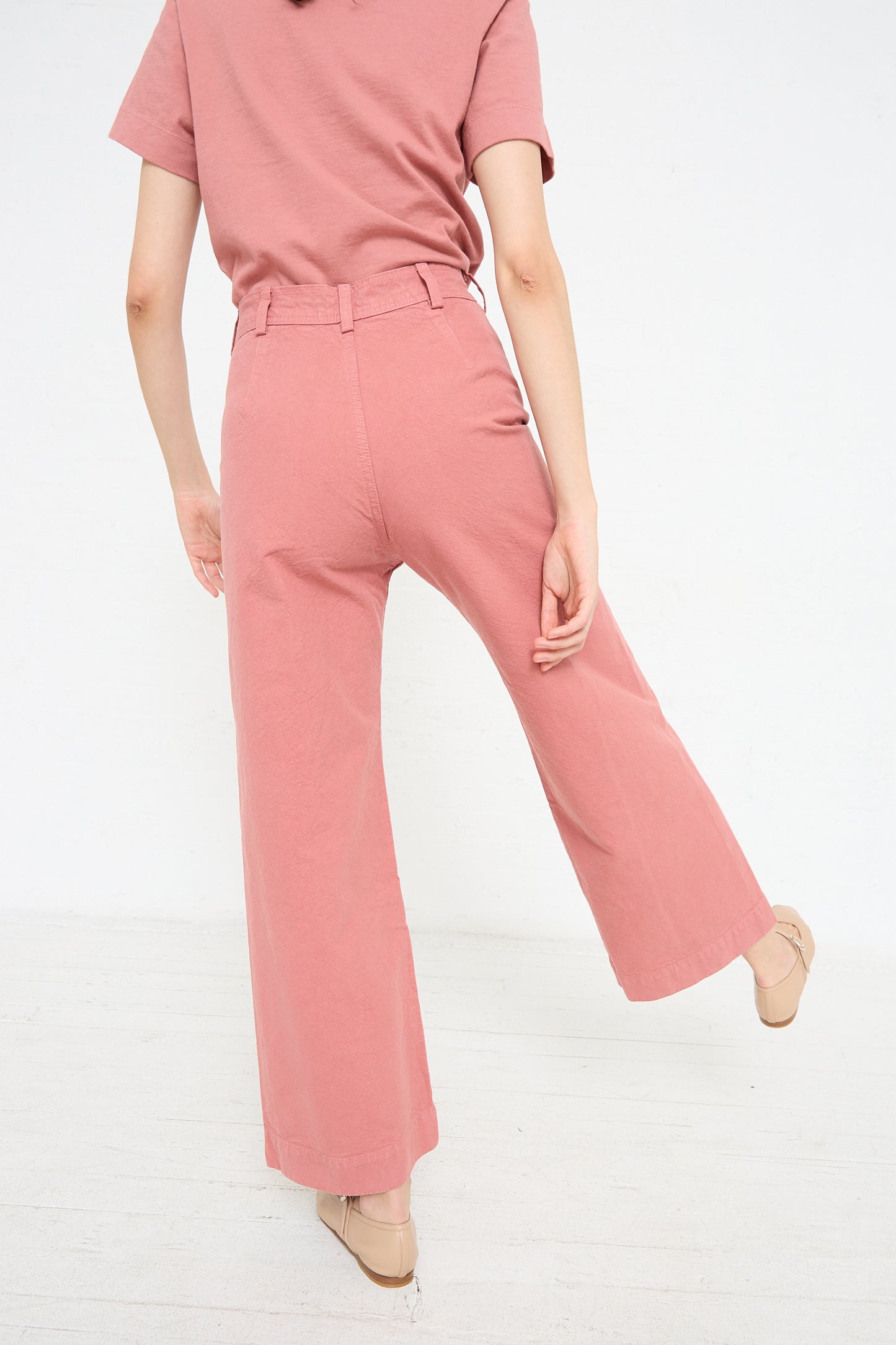 A woman wearing Sailor Pant in Dogwood by Jesse Kamm.