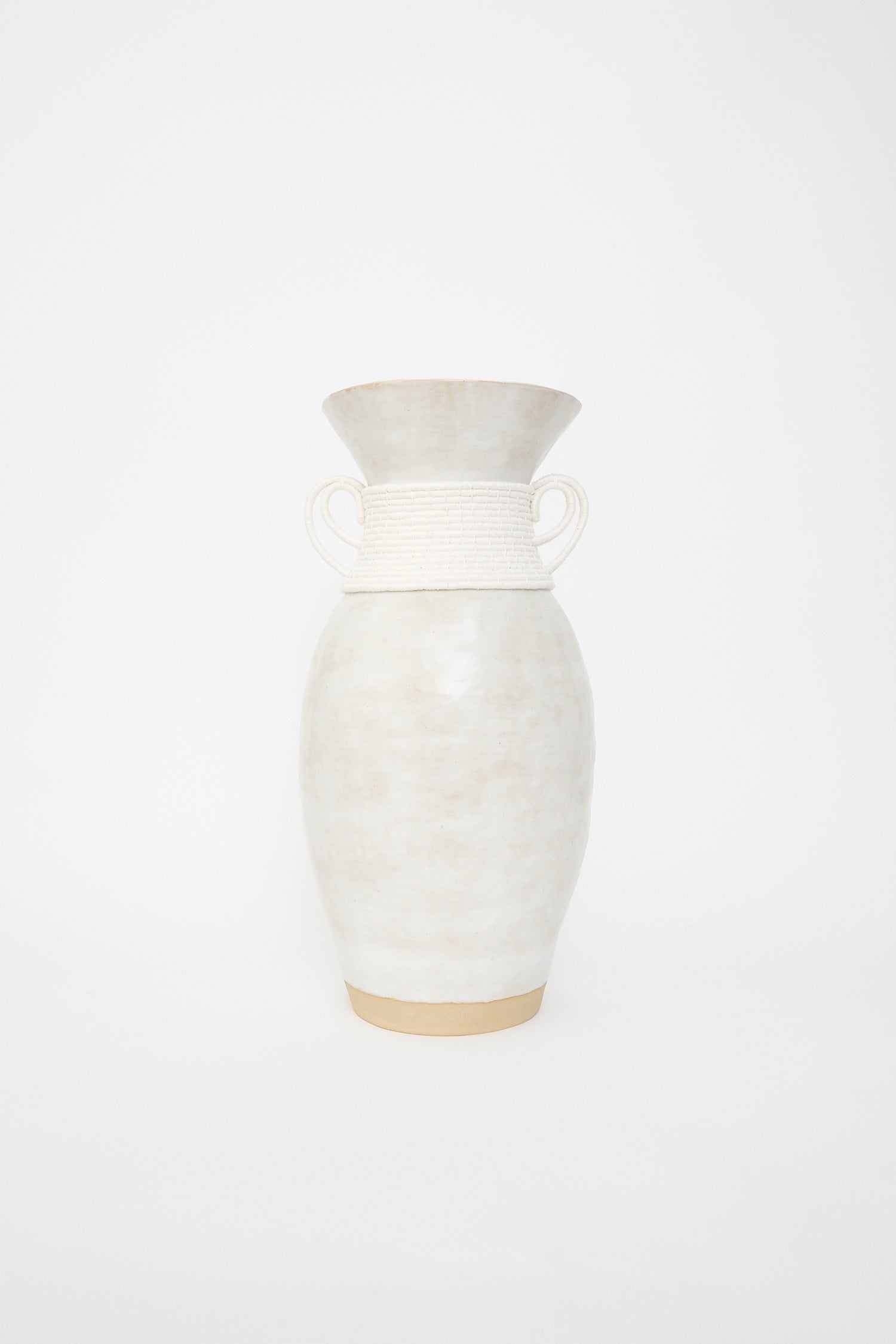 A handcrafted Karen Tinney stoneware Vase #810 with twin handles on a White background.
