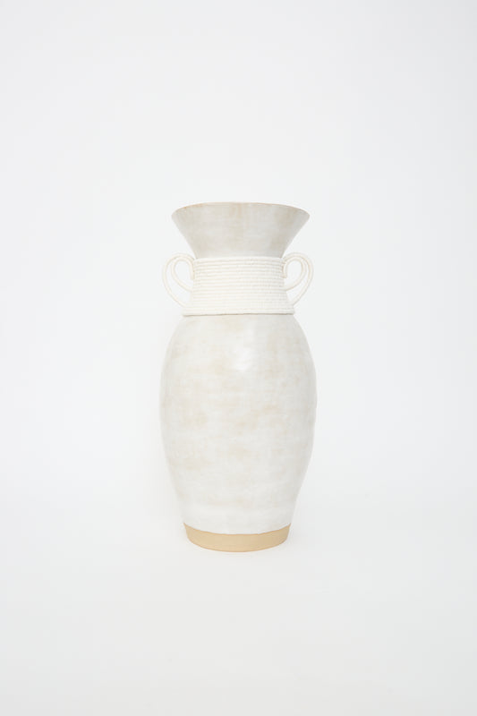 A handcrafted Karen Tinney stoneware Vase #810 with twin handles on a White background.