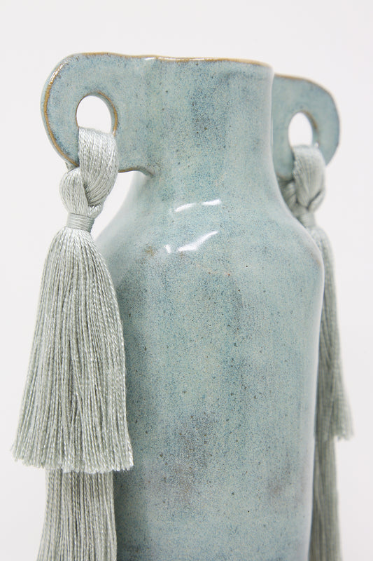 Handmade stoneware Vase #606 in Sage with robin's egg blue glaze and two textured tassels attached to its sides by Karen Tinney.