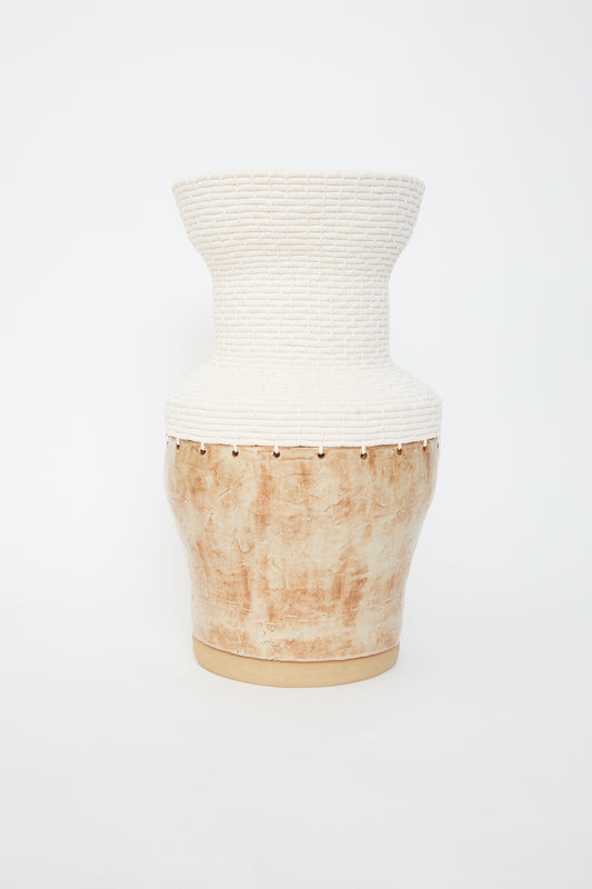 Handcrafted Vessel #760 in White and Natural ceramic vase by Karen Tinney with a textured upper half and a smooth, natural lower half against a white background.