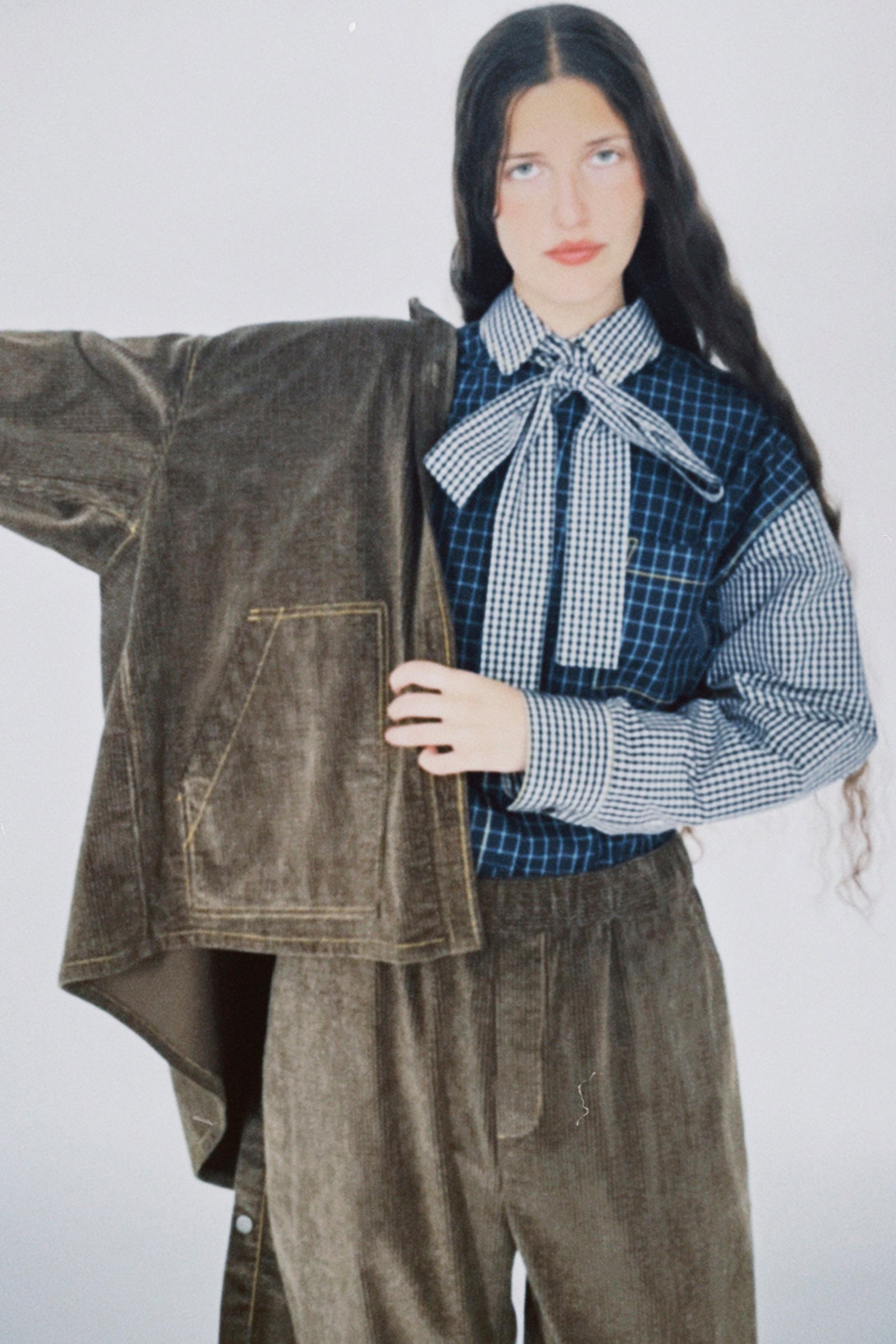 Person wearing pieces from KasMaria's PS26 collection on a white background