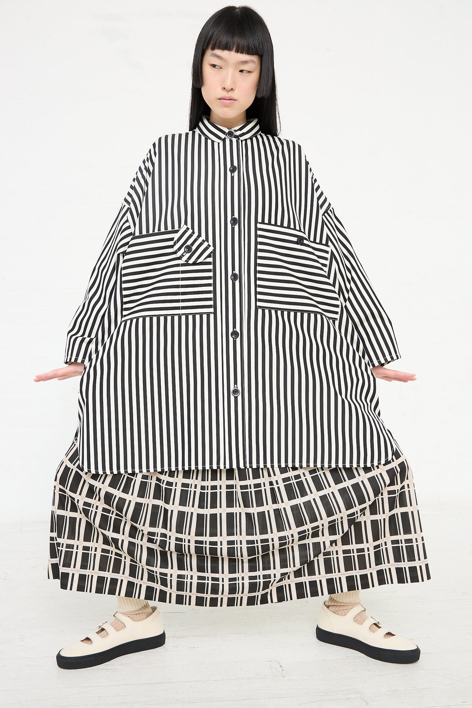 A model wearing the Cotton Poplin Oversized Smock Dress in Stripe by Kasmaria - OROBORO NYC