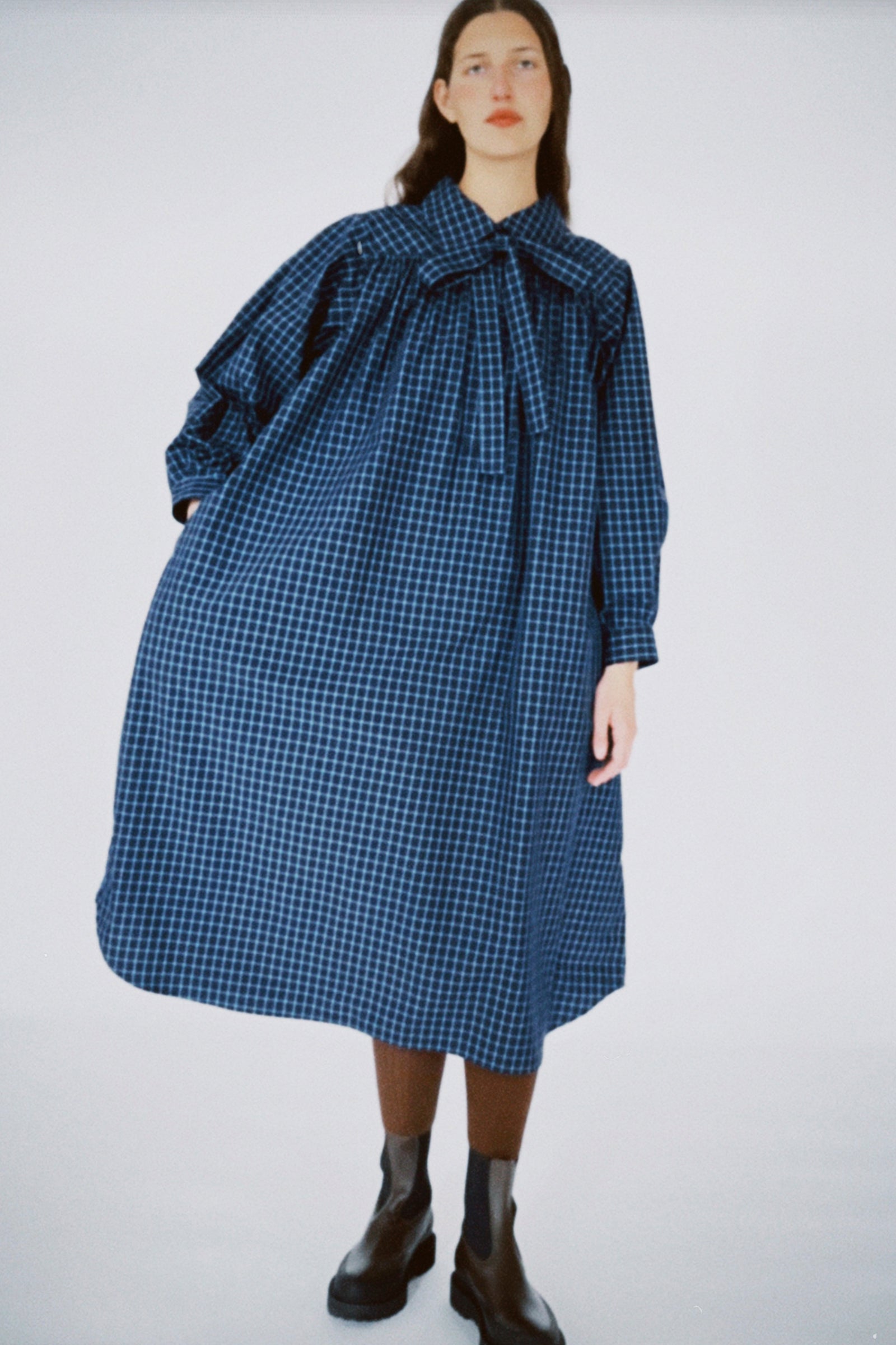 Woman wearing KasMaria's Cotton Poplin Smock Dress on a white background