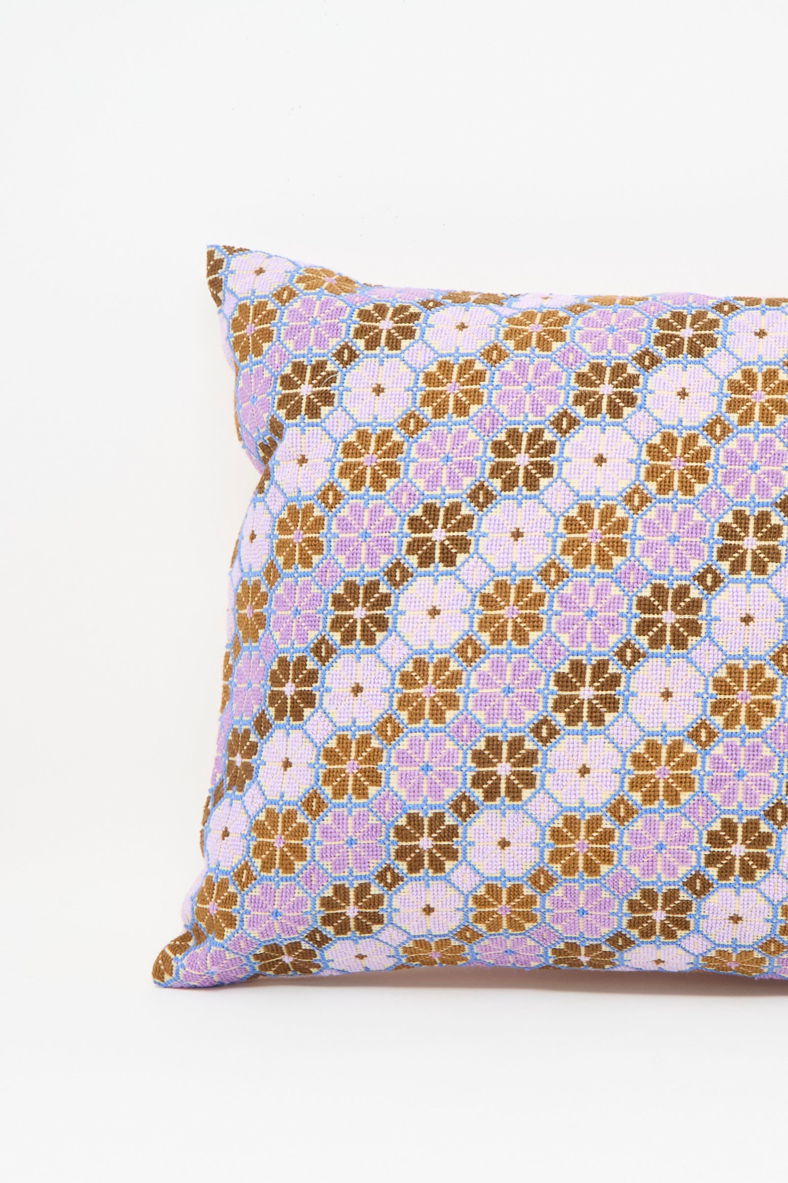 The Kissweh Damask Rose Hand Embroidered Pillow in Lilac and Cognac features a floral geometric design on white, crafted with plush down feather insert for comfort.