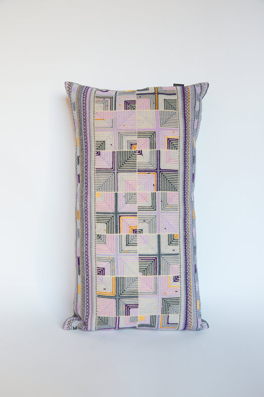 An artisan Double Feather Hand Embroidered Pillow in Greys & Lilac by Kissweh with a purple, yellow and grey pattern.