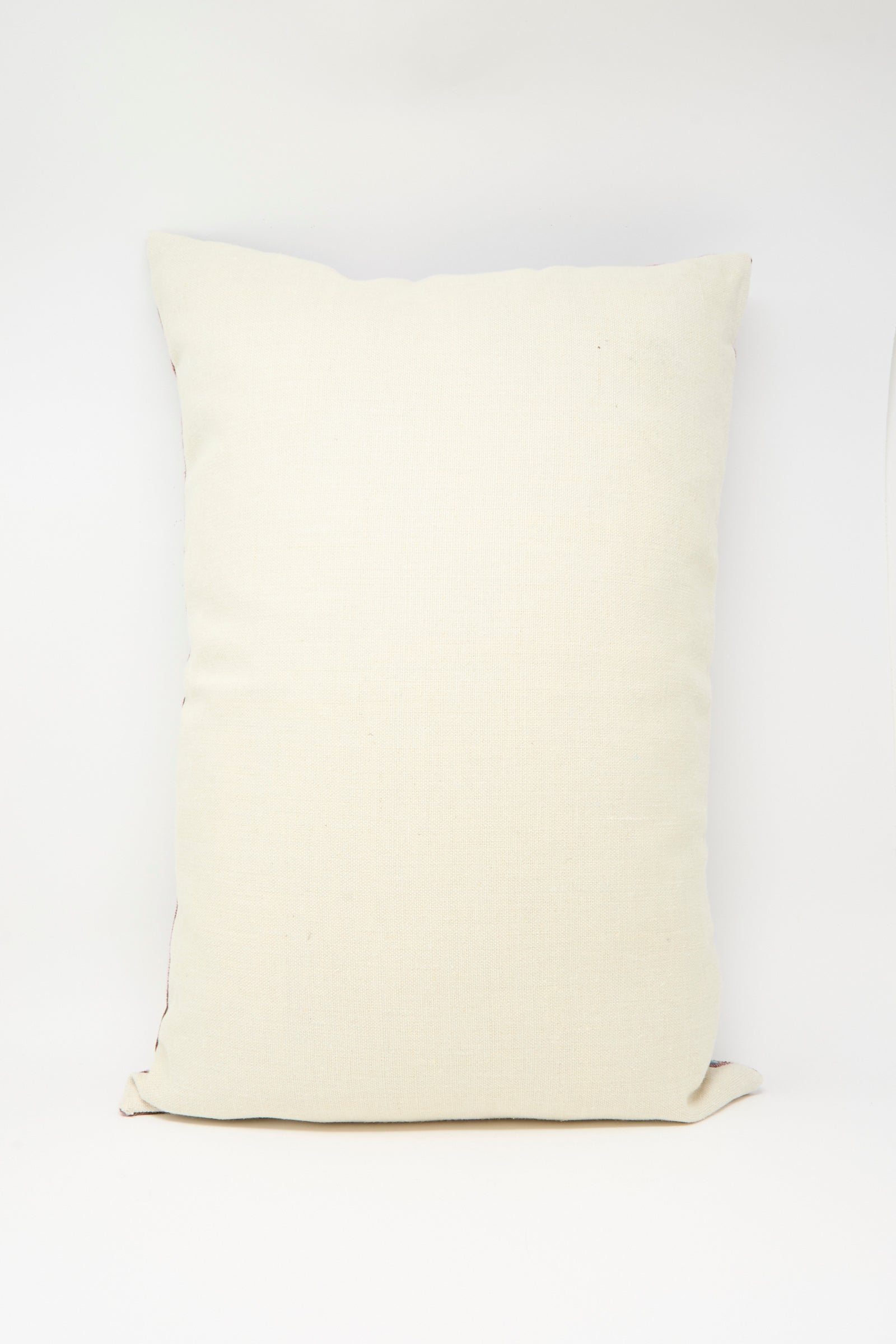 The Kissweh Imm Bushra Hand Embroidered Pillow in Chocolate, rectangular in shape, is displayed against a white background.