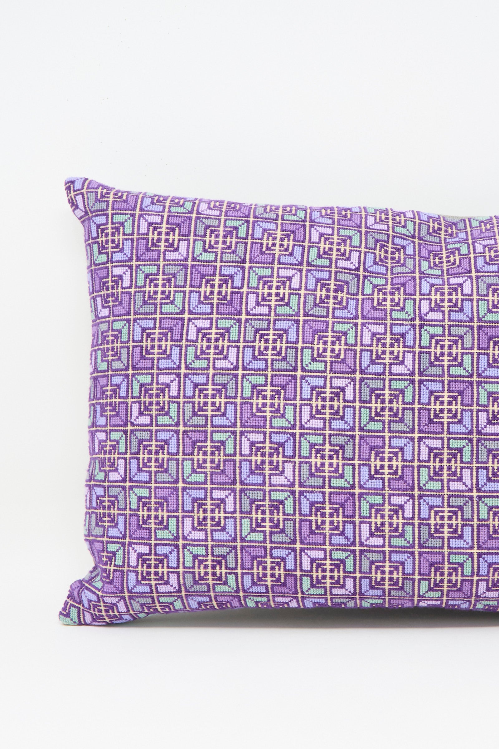 The Rana Hand Embroidered Pillow in Lilac and Purple I by Kissweh features a geometric square design in purple, pink, and light blue on white Libeco Belgian linen for a luxurious touch.