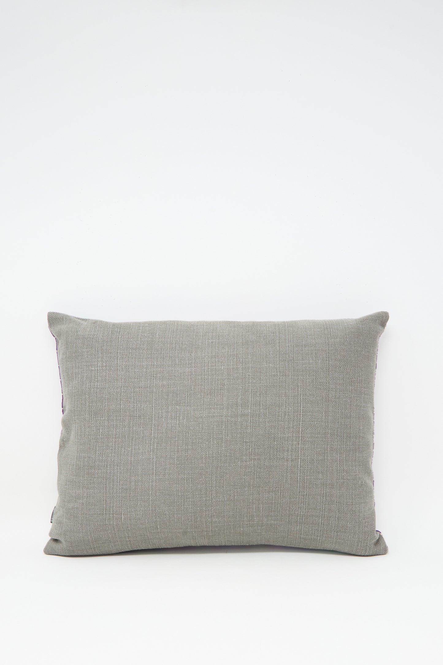 The Rana Hand Embroidered Pillow in Lilac and Purple I by Kissweh features detailed embroidery, displayed against a plain white background.
