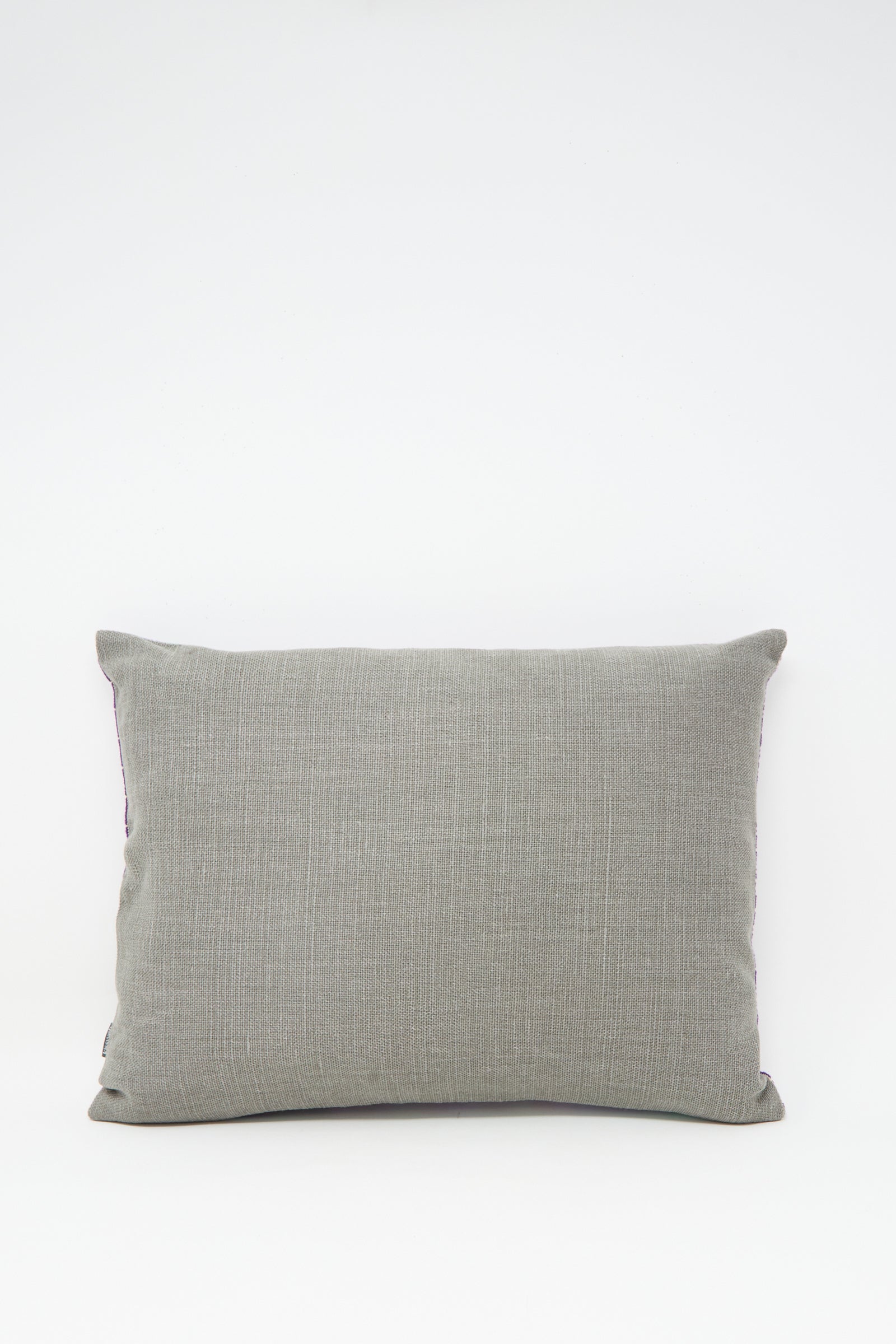 The Rana Hand Embroidered Pillow in Lilac and Purple I by Kissweh features detailed embroidery, displayed against a plain white background.