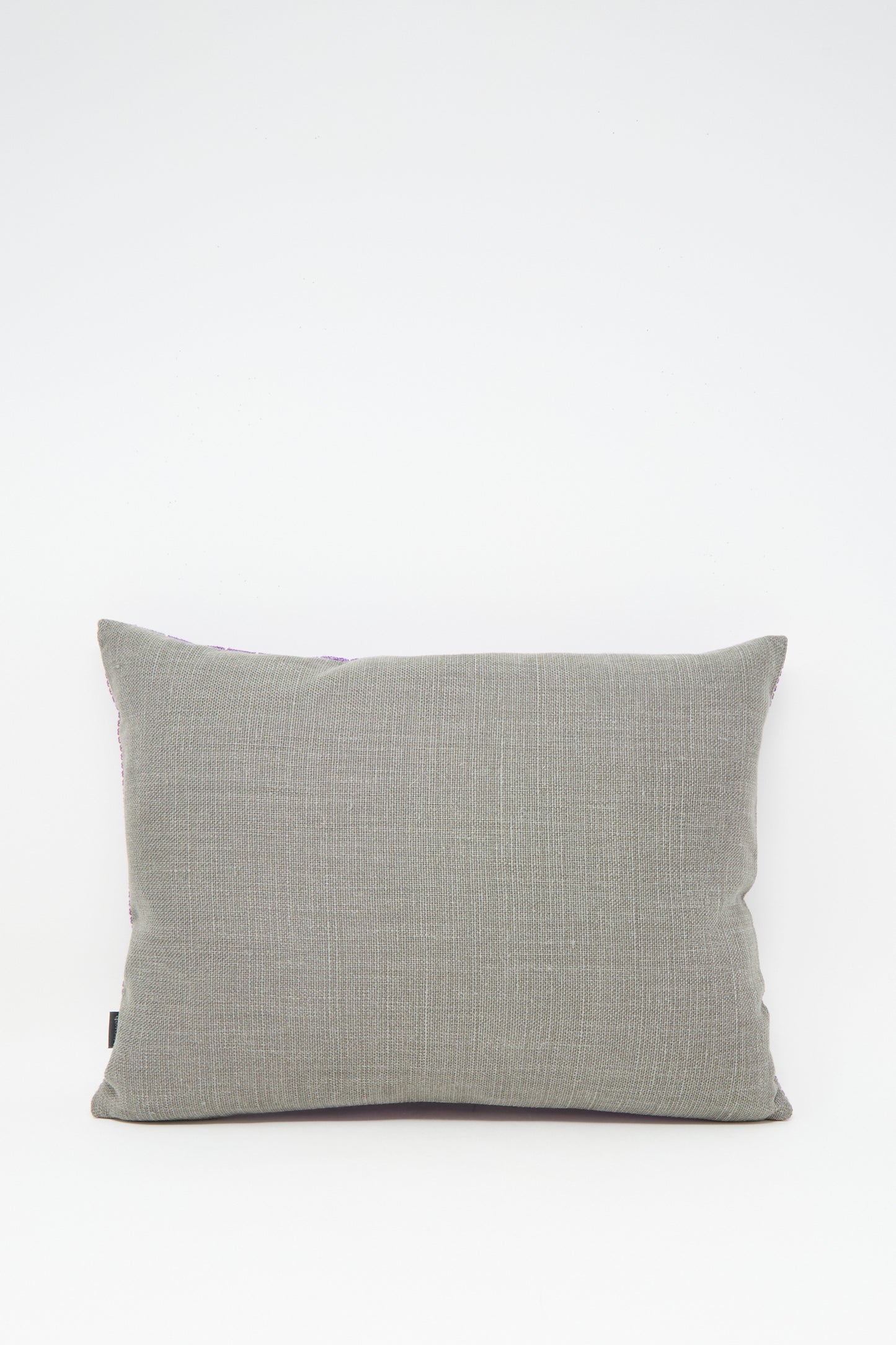 The Rana Hand Embroidered Pillow in Lilac and Purple II by Kissweh is displayed against a plain white background.
