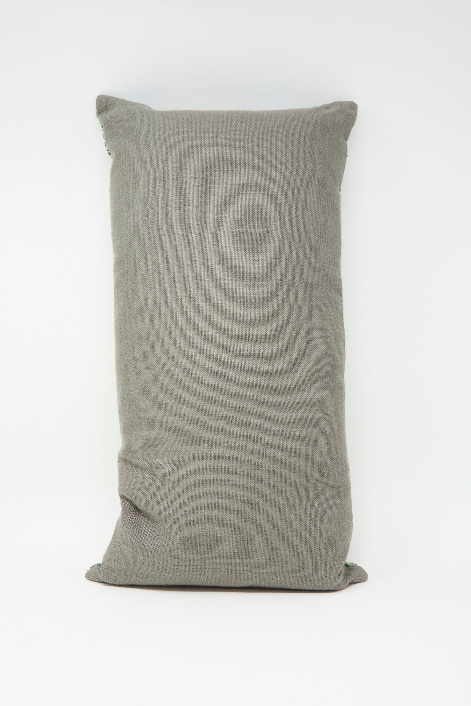 The Yasmin Hand Embroidered Pillow in Olive by Kissweh features a rectangular design and intricate embroidery, shown against a white background.