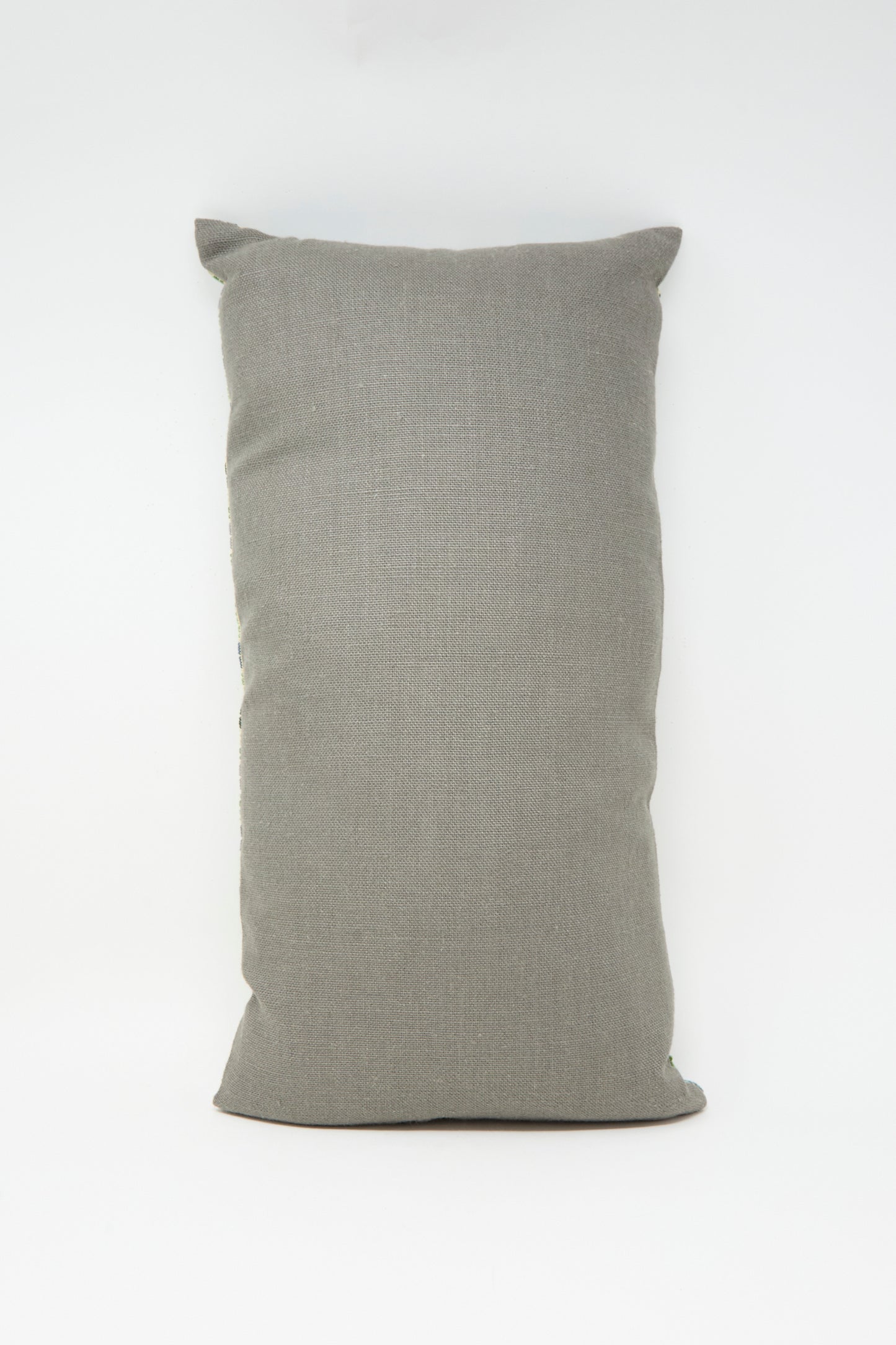 The Yasmin Hand Embroidered Pillow in Olive and Slate by Kissweh is positioned upright against a white background.