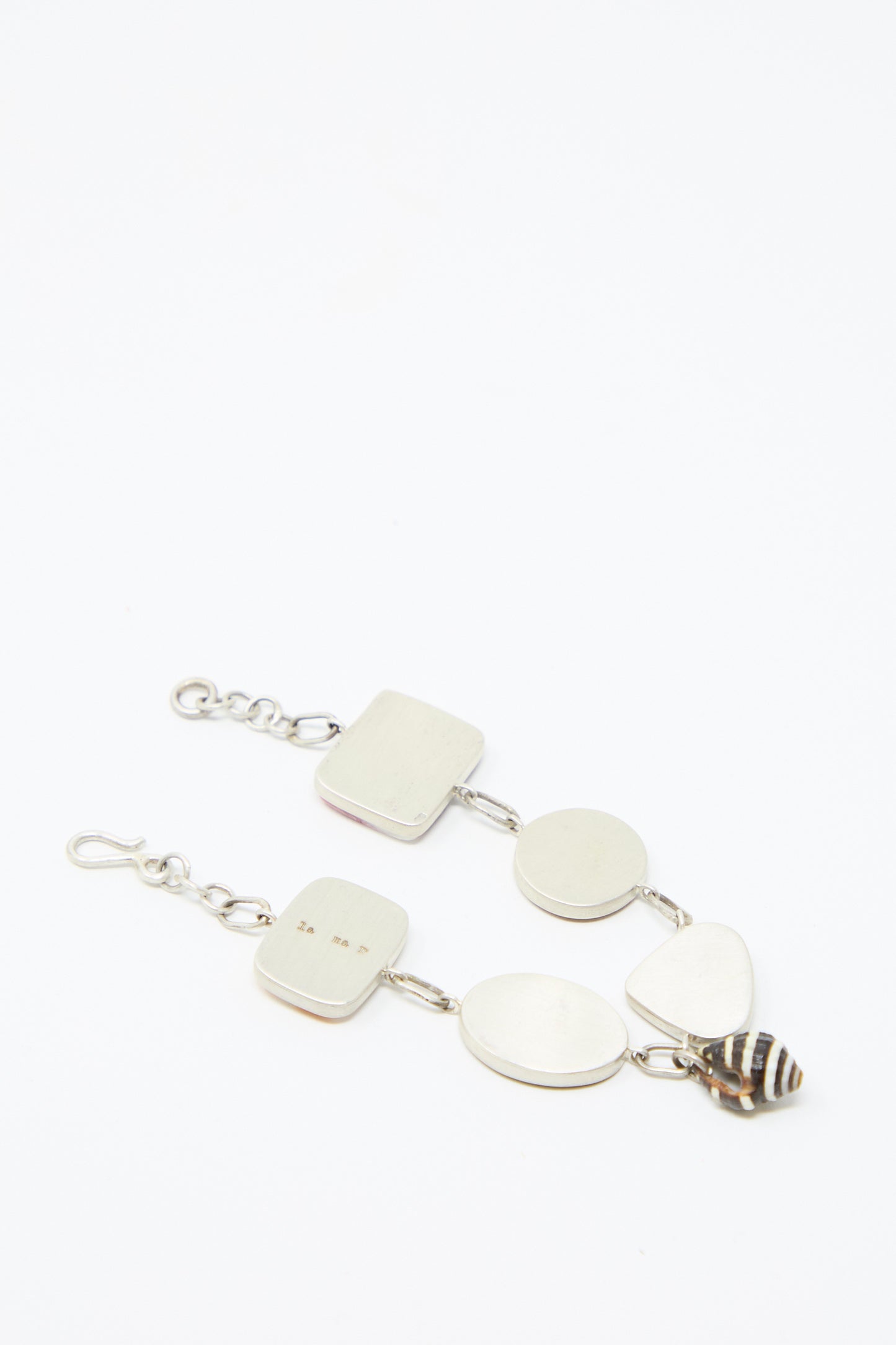 The back of the Sterling Silver No. 001 Bracelet in Shell II by La Mar, featuring a chain-link design, against a white background.