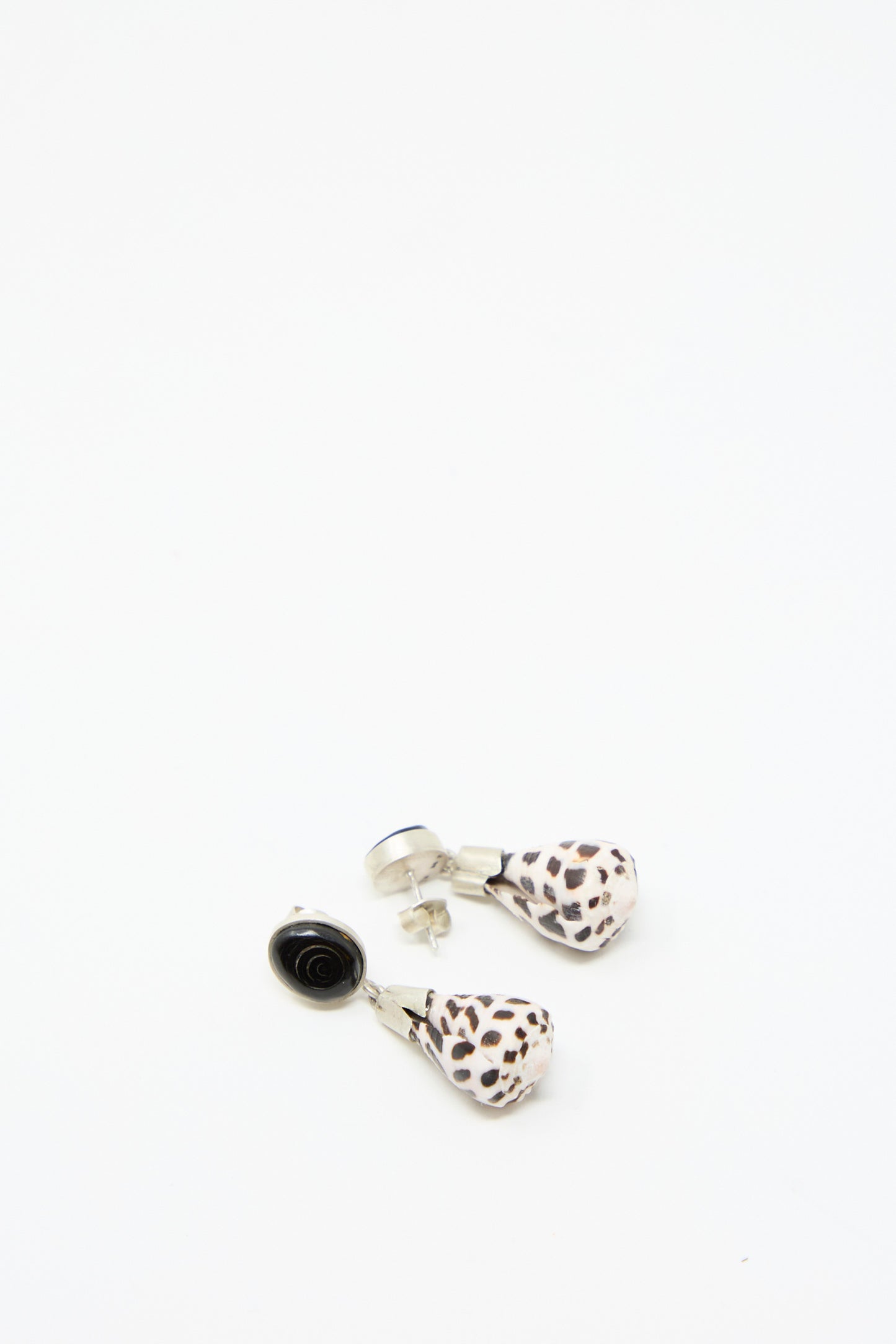 The Sterling Silver No. 09 Earrings from La Mar, featuring a teardrop-shaped shell with sterling silver tops, on a white background.