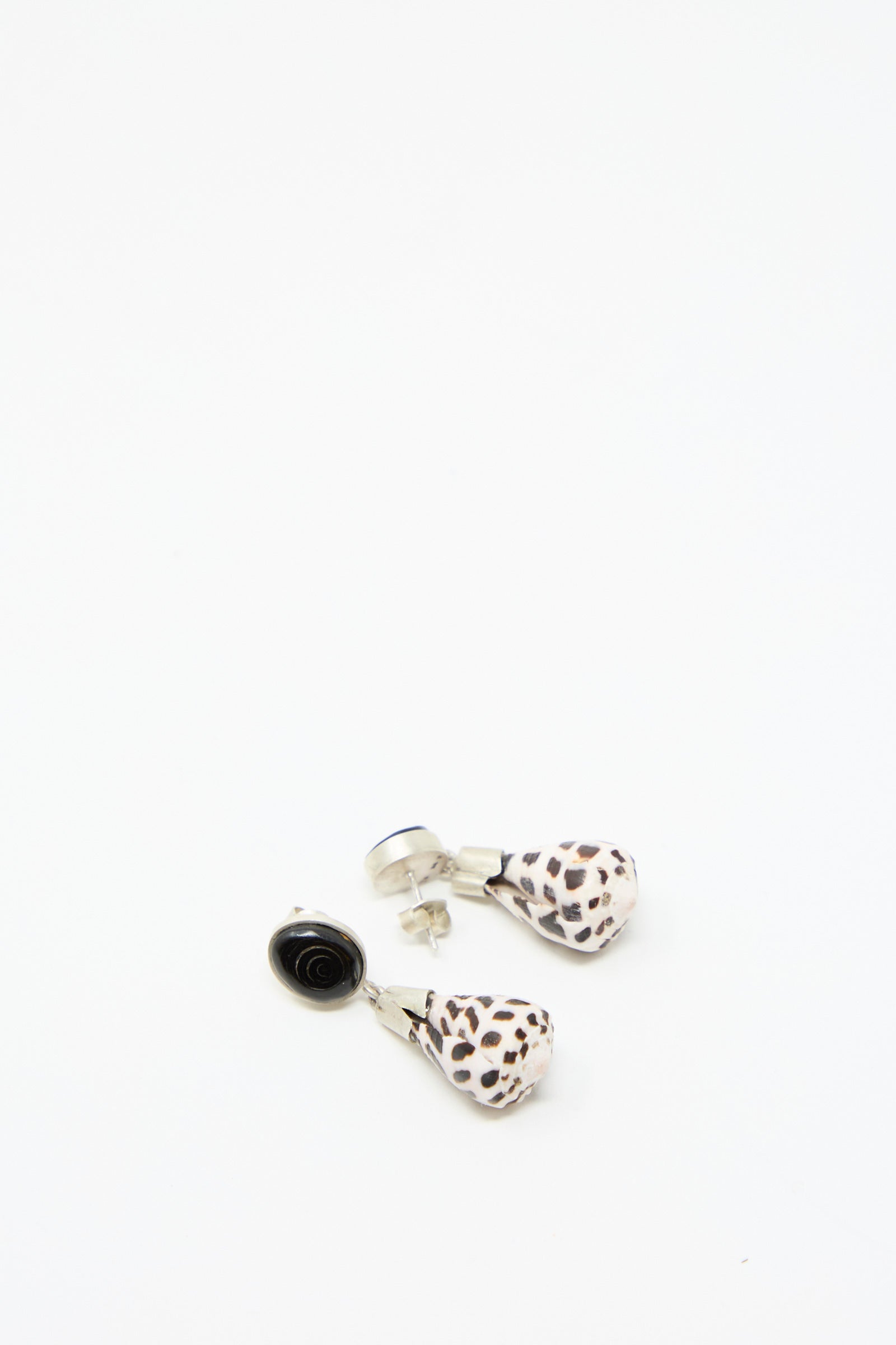 The Sterling Silver No. 09 Earrings from La Mar, featuring a teardrop-shaped shell with sterling silver tops, on a white background.