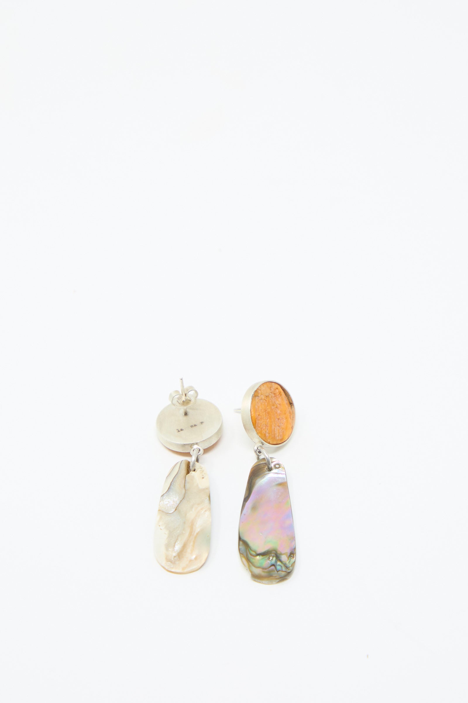 Discover the Sterling Silver No. 09 Earrings in Orange and Shell from La Ma r, featuring round sterling silver studs with shell pendants. Features the back of one earring.