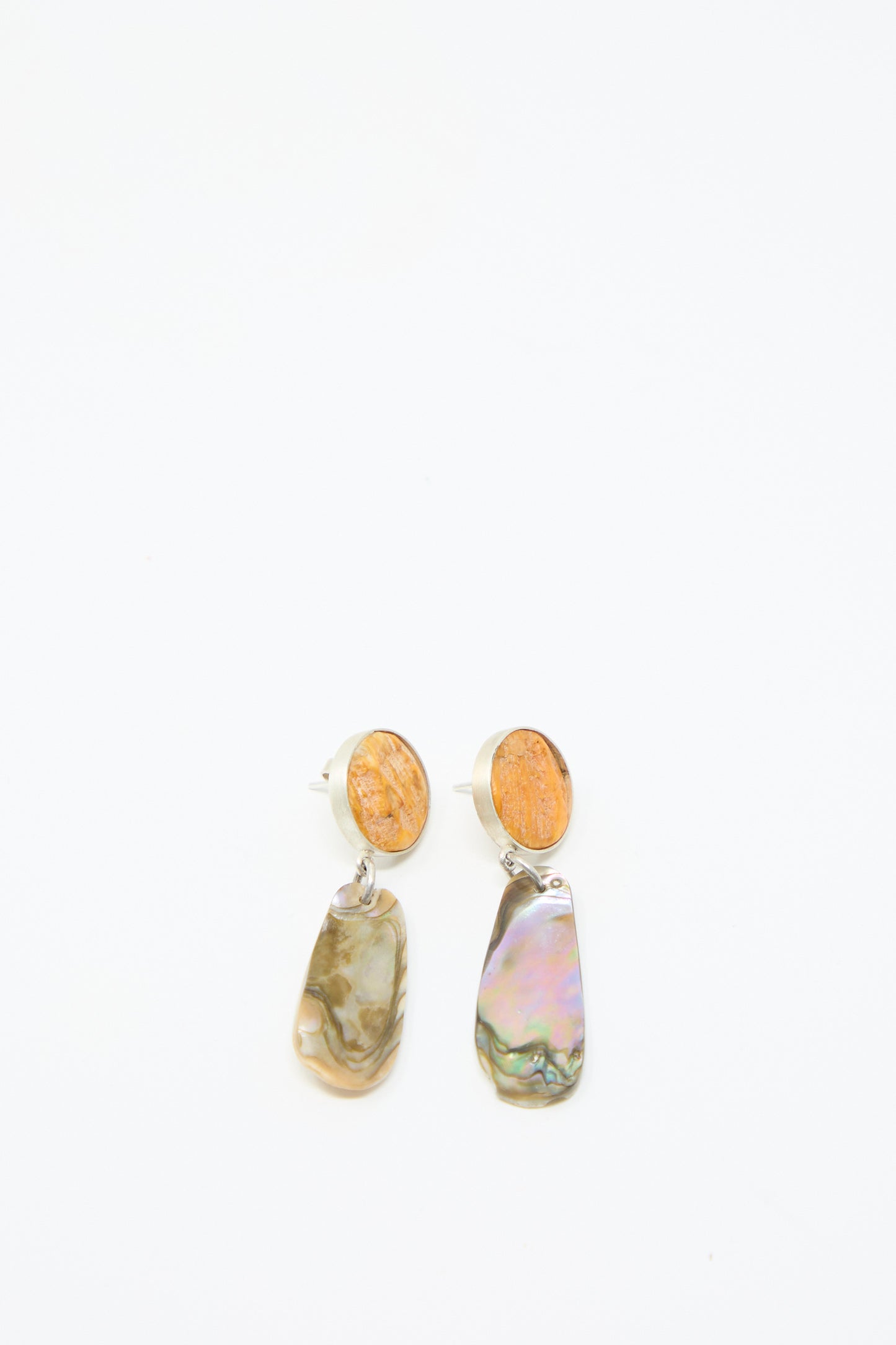 A pair of drop earrings from La Ma r, named Sterling Silver No. 09 Earrings in Orange and Shell, featuring sterling silver circular orange studs with dangling irregular-shaped multicolored stones, displayed on a white background.