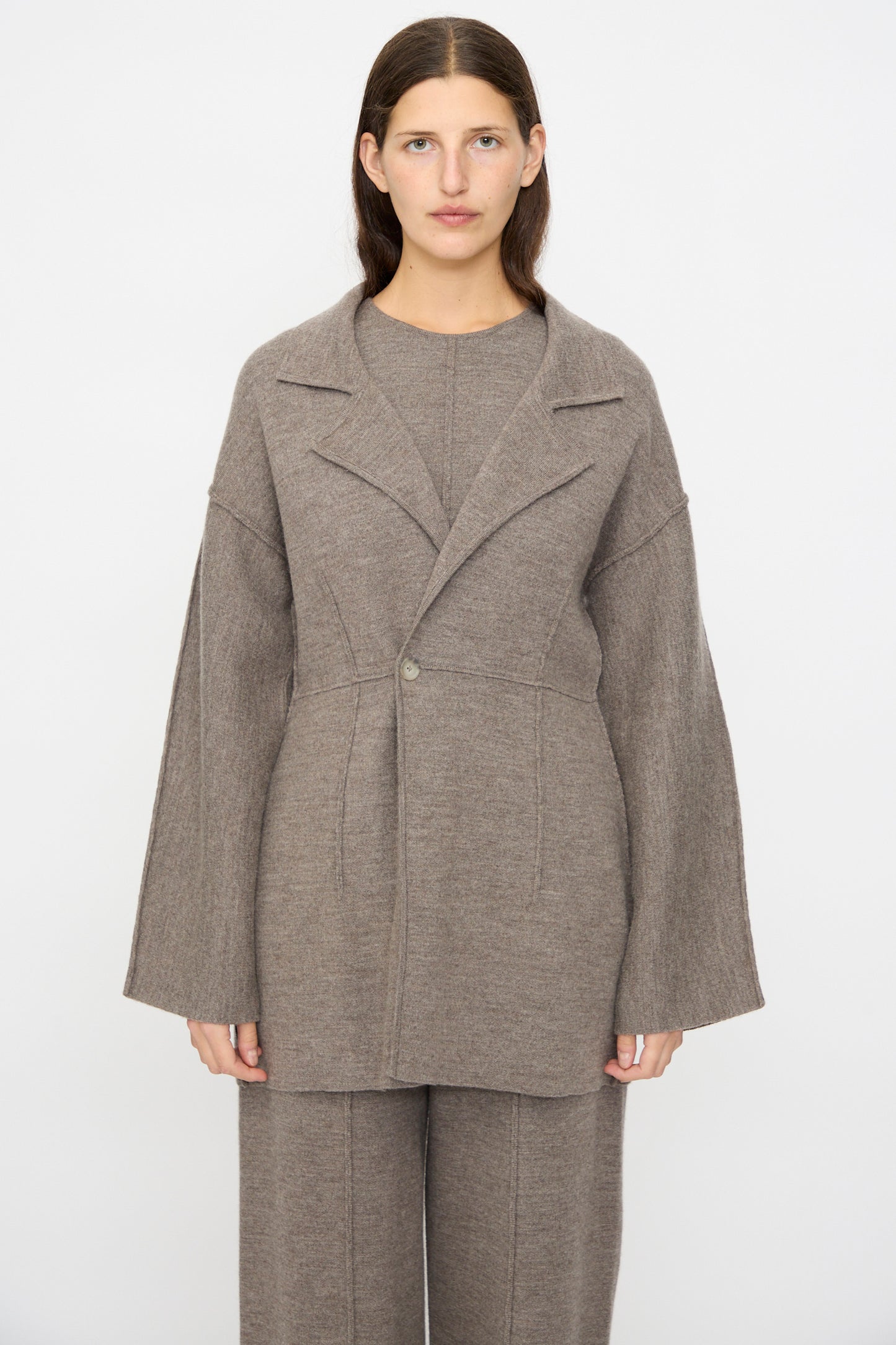 A woman faces forward wearing the Lauren Manoogian Double Knit Blazer in Cinder with matching wide-leg pants, set against a plain white background.