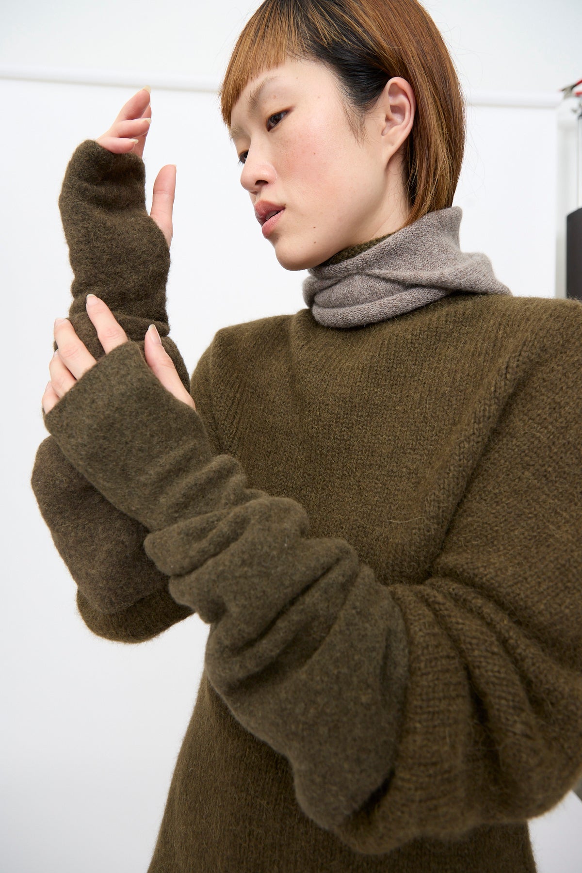 Lauren Manoogian Felt Fingerless Gloves in olive, an elbow-length glove worn scrunched to the forearm.