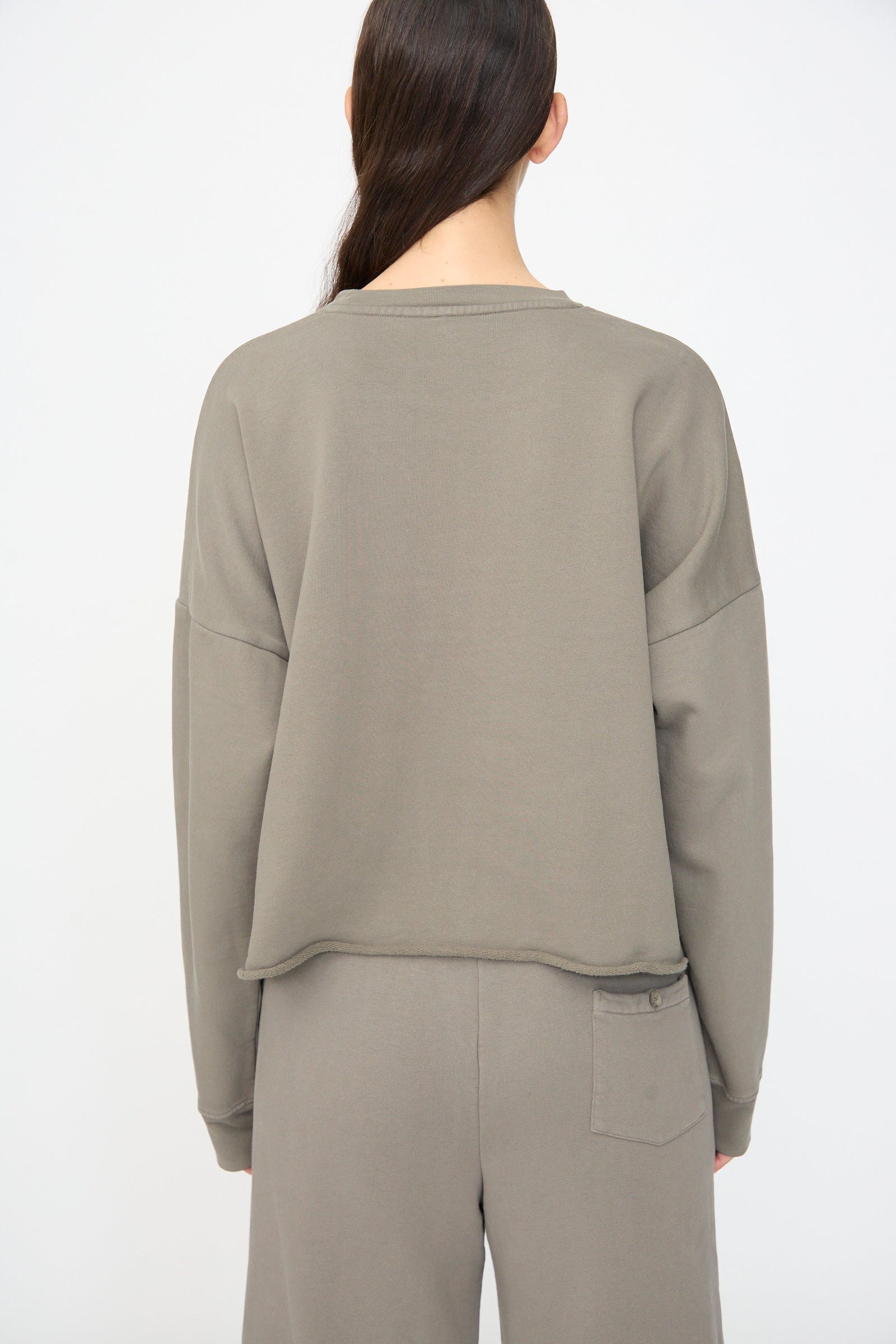 Person wearing the Lauren Manoogian Fleece Crewneck in Fatigue, shown from the back against a plain white background.