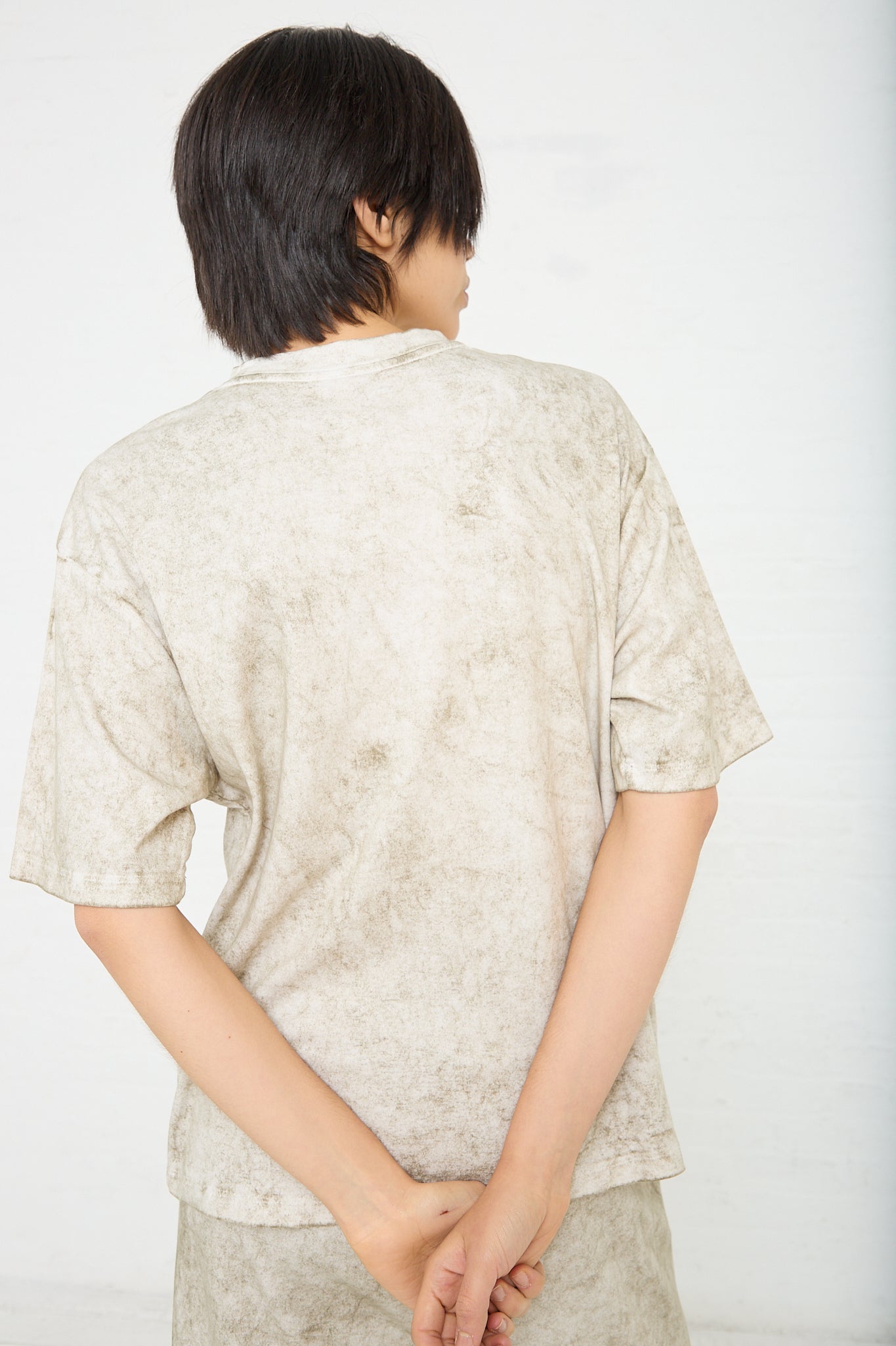 The Lauren Manoogian Pima Cotton Lunar Tee in Olive features a boxy silhouette and dropped shoulders, creating an oversized tee look. Back view.