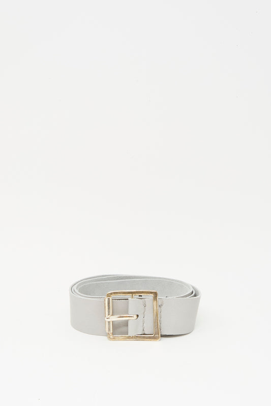 The Lauren Manoogian Plata Belt in Gris features light gray leather with a handmade silver buckle, shown on a plain white background.