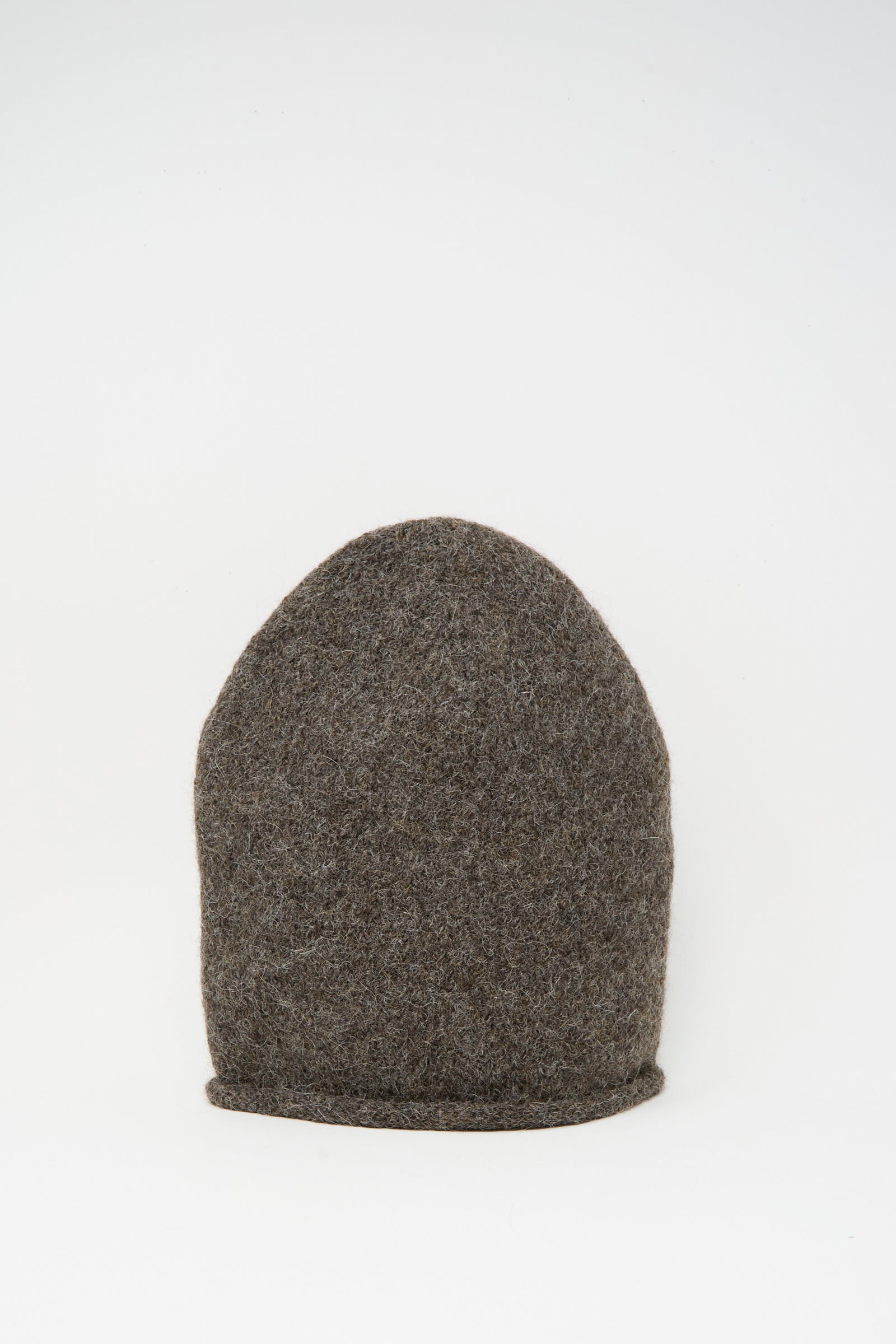 The Lauren Manoogian Crown Beanie in Patina, a brown, dome-shaped hat made from a cozy knit alpaca blend, is shown against a plain white background.