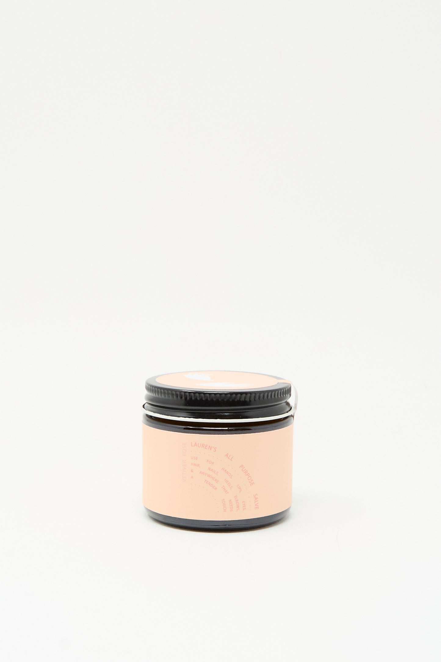 The Lauren's All Purpose Rose Vetiver Salve 45ml Jar, featuring a black lid and a light pink label with minimal text, is shown against a plain white background.