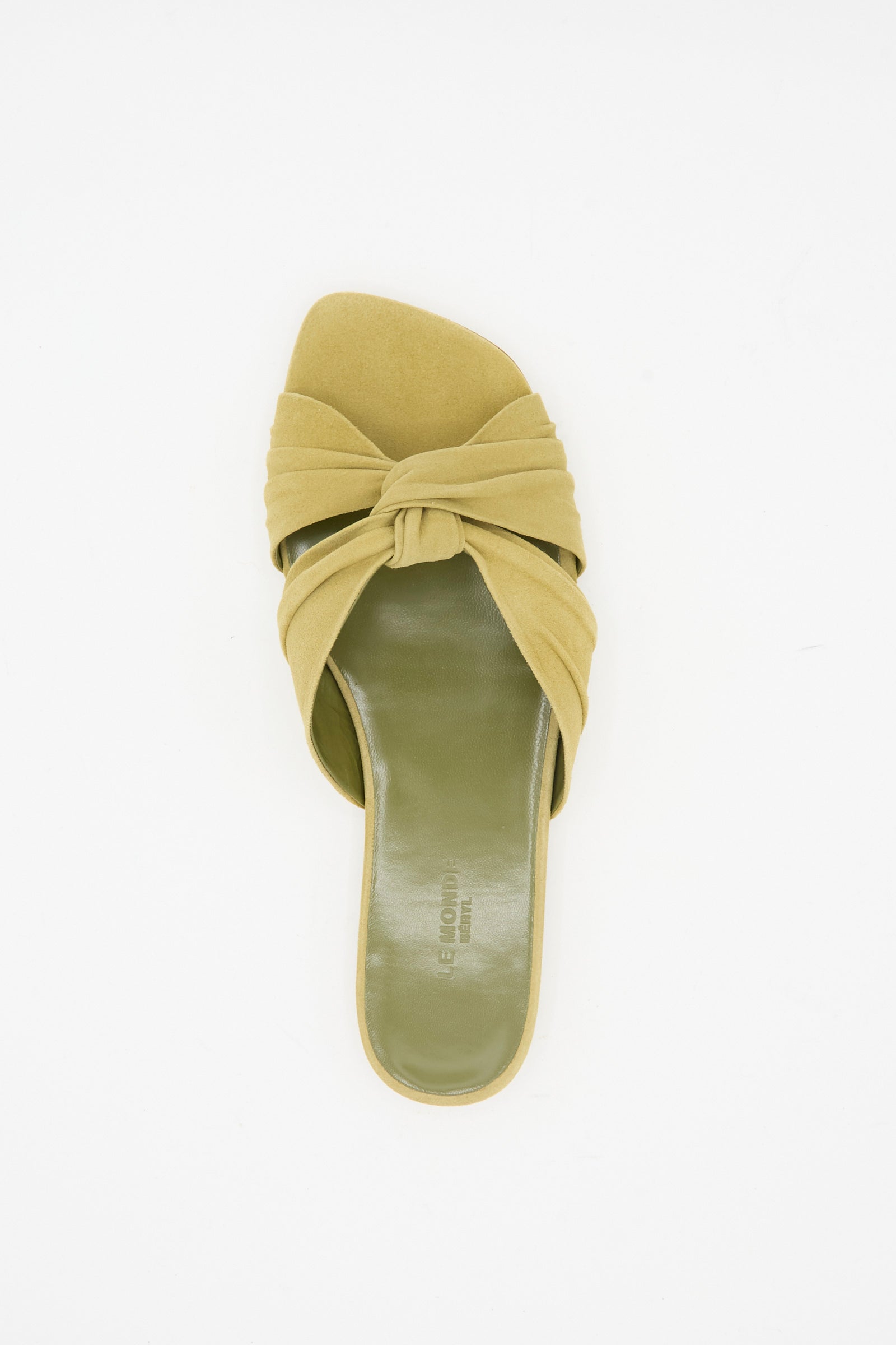 The Le Monde Beryl Antonia Flat in Grey Green is a single slide shoe with a knotted Italian suede strap and square open toe, shown from above on a white background.