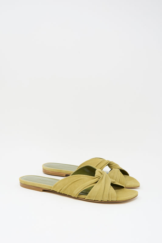 The Antonia Flat in Grey Green by Le Monde Beryl is an open-toe slide sandal featuring knotted fabric straps, shown on a plain white background.