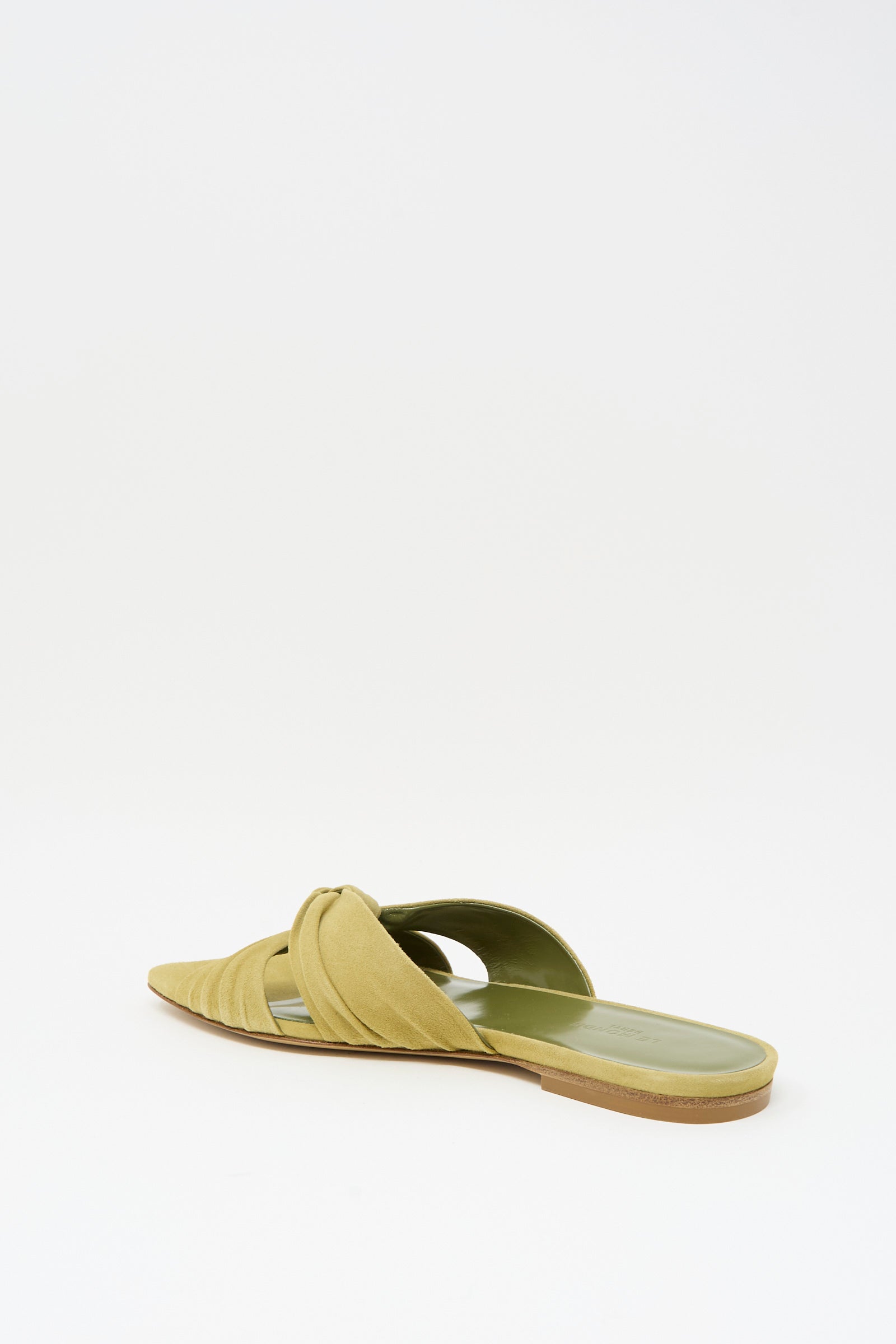 The Antonia Flat in Grey Green by Le Monde Beryl is a pointed toe Italian suede slip-on with crisscross detail, shown against a plain white background.