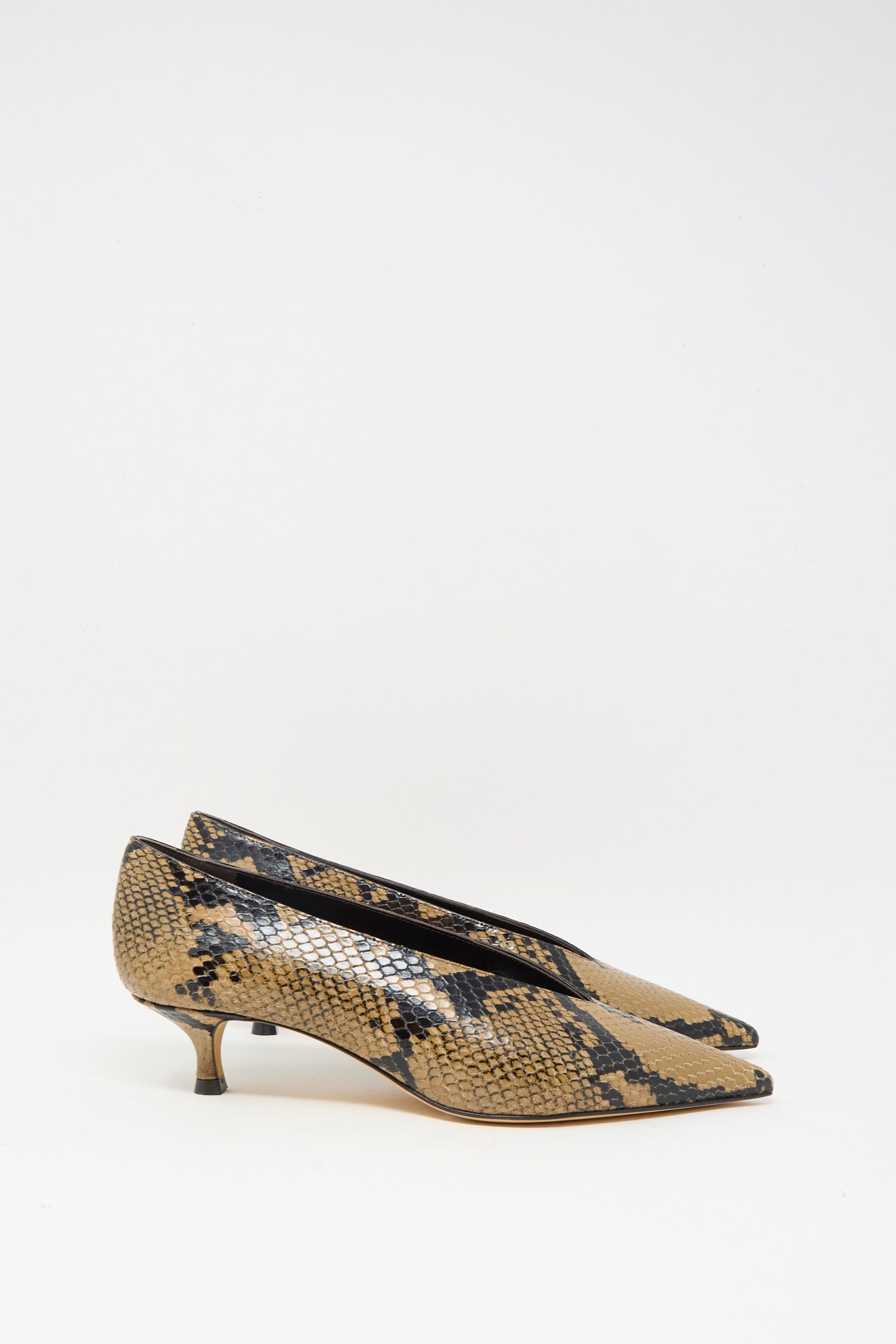 The Le Monde Beryl Babouche Kitten Heel in Fango features a pointed toe and kitten heel in beige and black snake-embossed leather, shown against a plain white background.