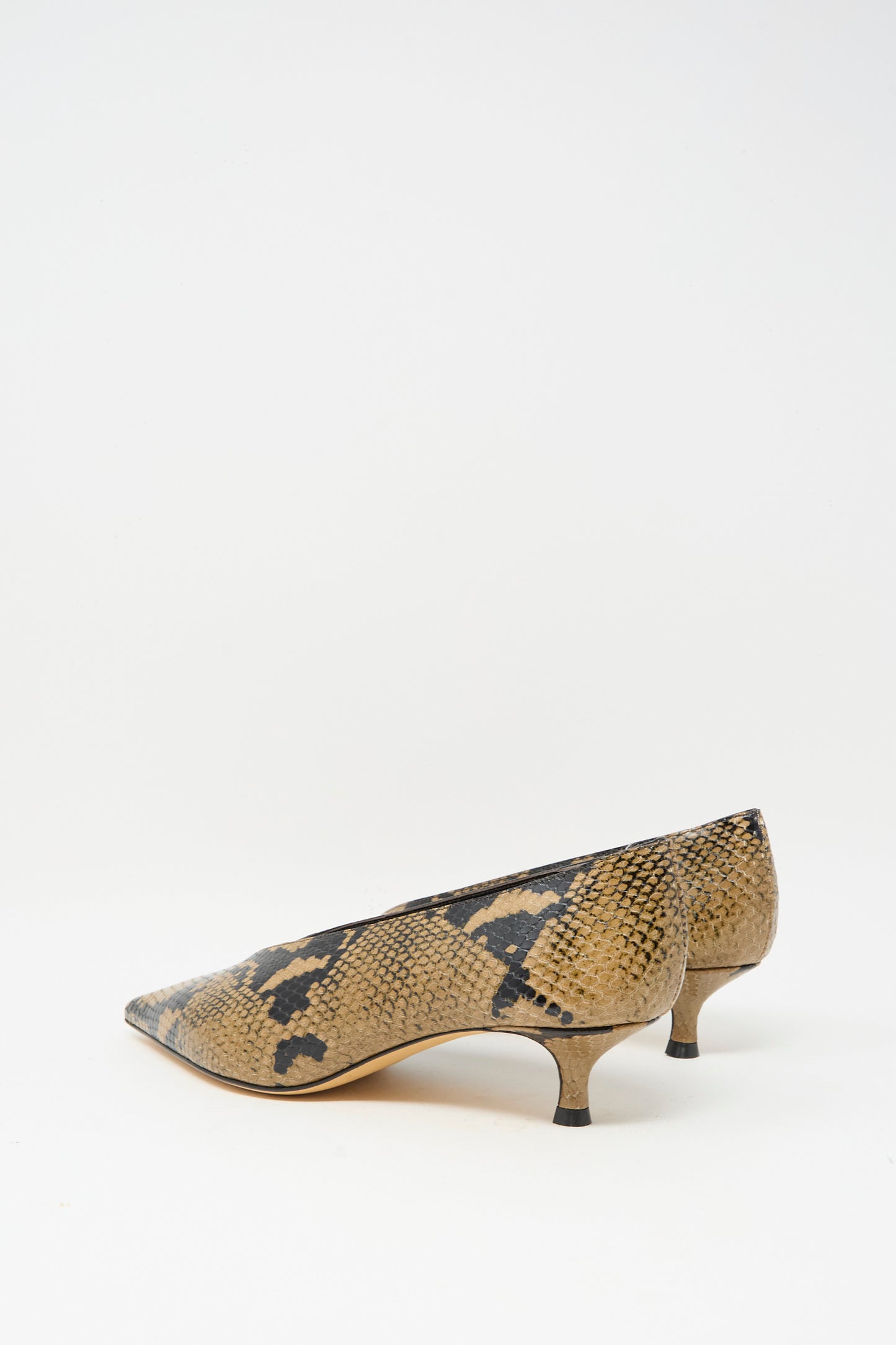 The Babouche Kitten Heel in Fango by Le Monde Beryl features low heels and pointed toes, crafted from brown and black snake-embossed leather, and is displayed on a white background.